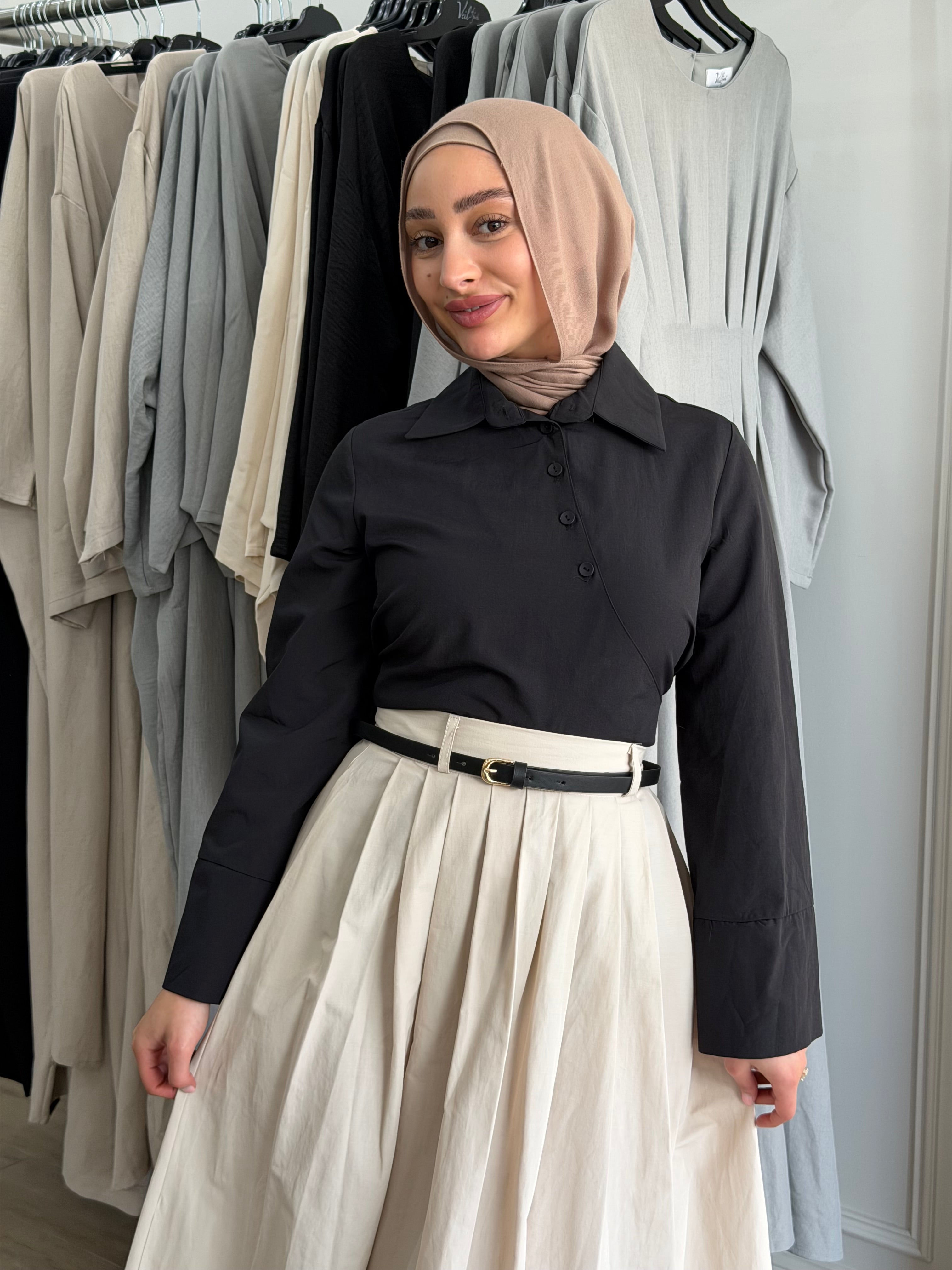 Manal wrap shirt styled with the wrap tie fastened at the front for a defined silhouette.
