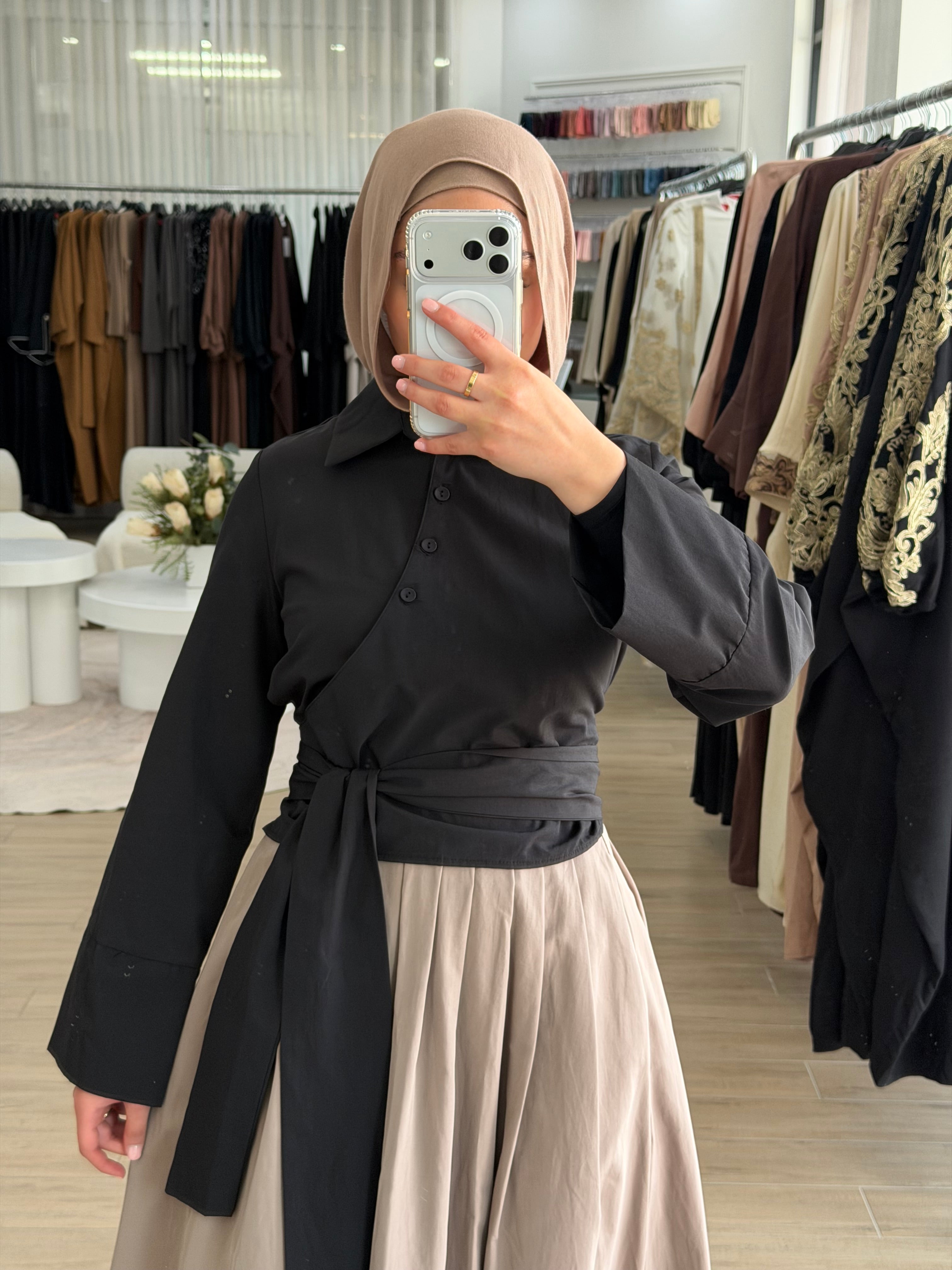 Manal wrap shirt styled with the wrap tie fastened at the front for a defined silhouette.