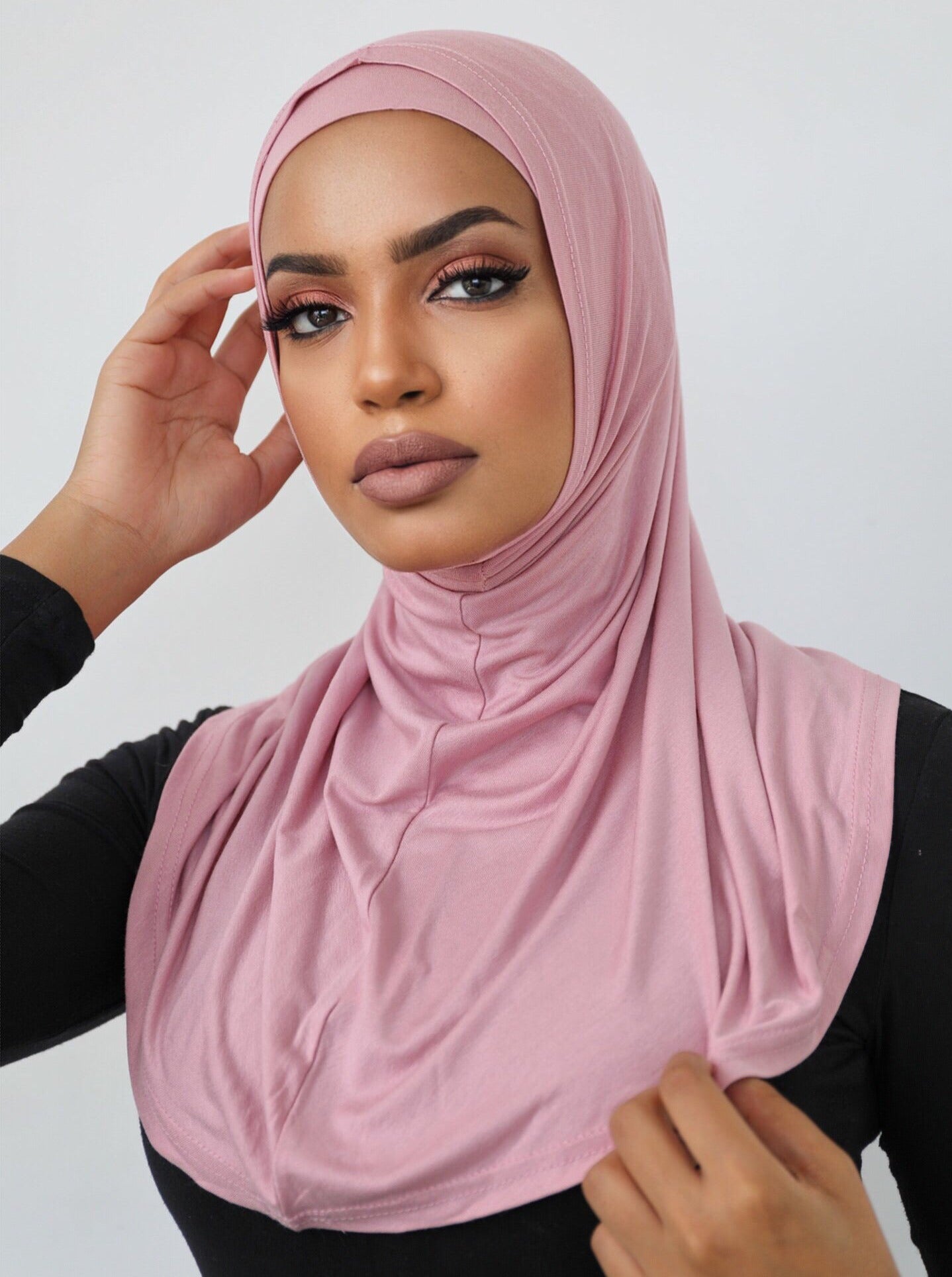 Our signature 2 piece scarf is made from a soft and stretchy, breathable cotton. It features a cap and overlay scarf that covers the head, neckline and skims over the shoulders. Wear it with your basics for an easy look.