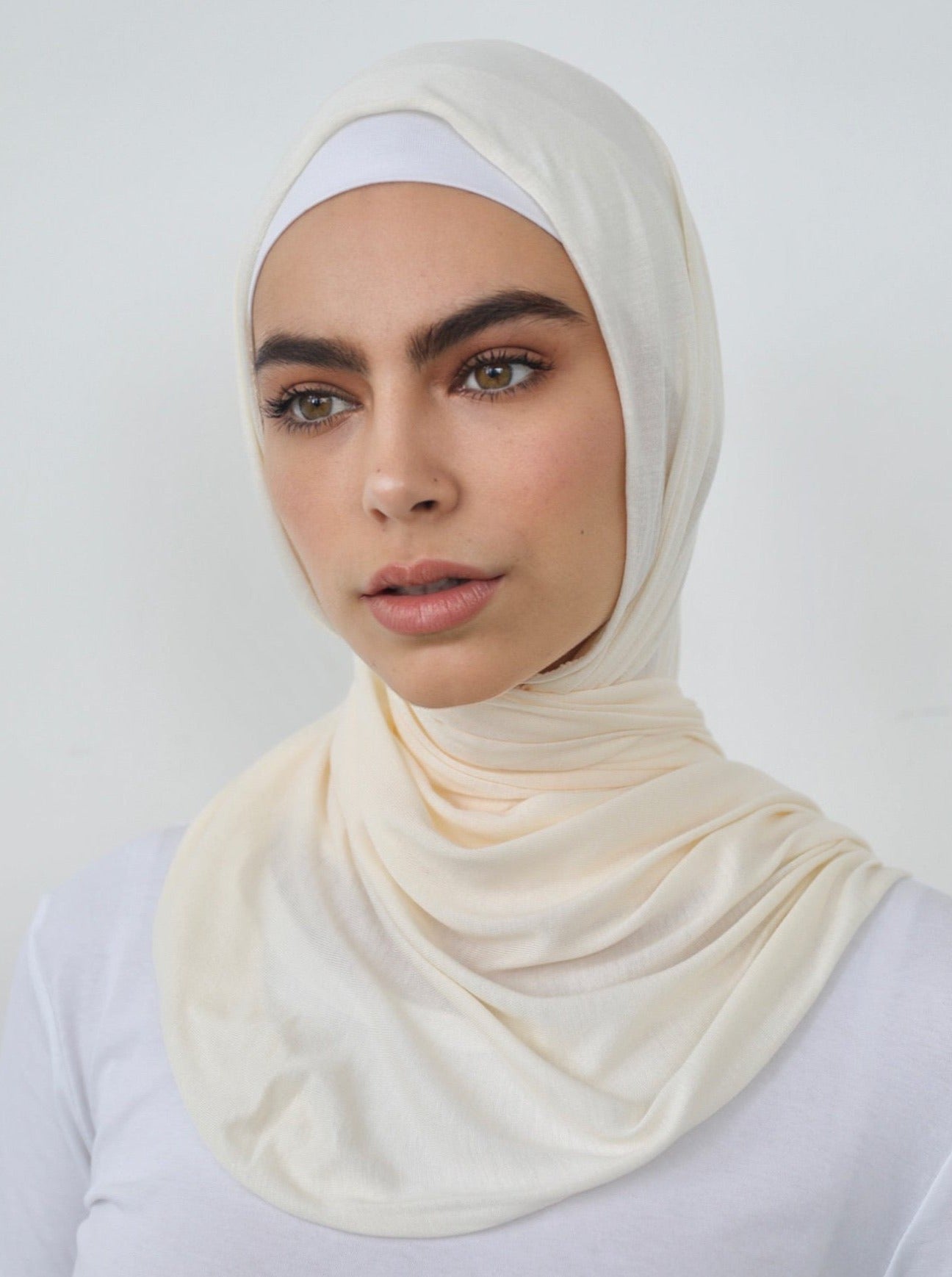 Signature jersey scarf made from soft, stretchy cotton with an extended length for easy wrapping and a secure, comfortable fit around the head.