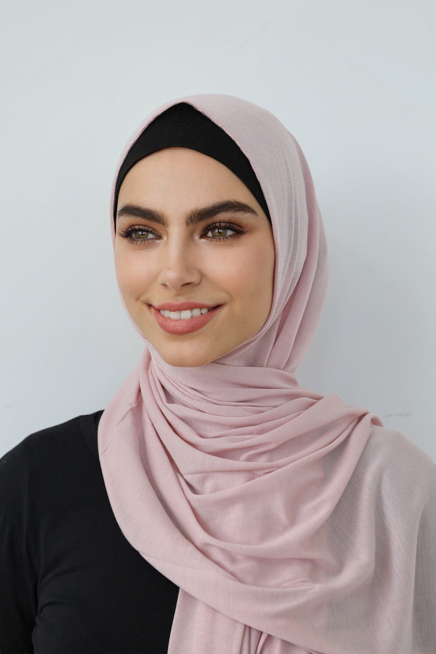 Signature jersey scarf made from soft, stretchy cotton with an extended length for easy wrapping and a secure, comfortable fit around the head.