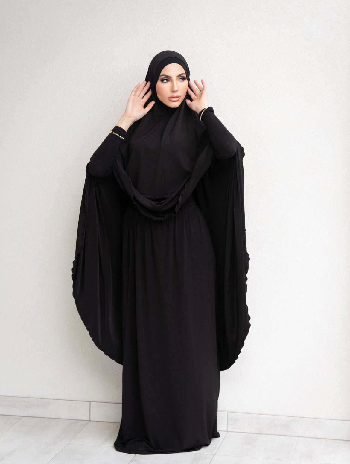 Our signature pray set is made of a loose and comfortable fabric. It features our large signature jilbab and a matching floor length skirt. 