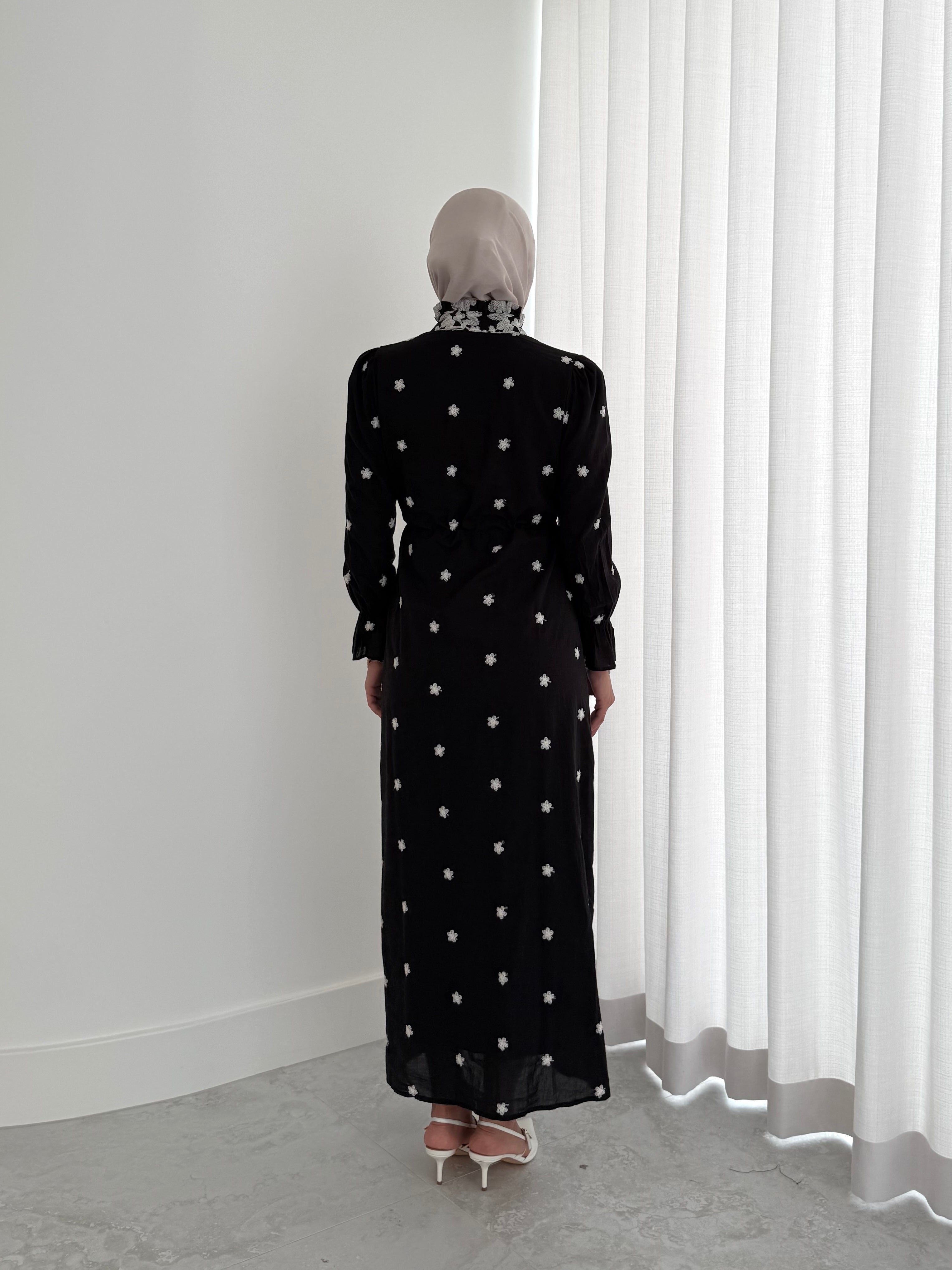 women's modest maxi dress in black and ivory with floral embroidery. dress is lined, long sleeve and lightweight, hijabi friendly and feminine for brunch, party, dinner, events and eid. 