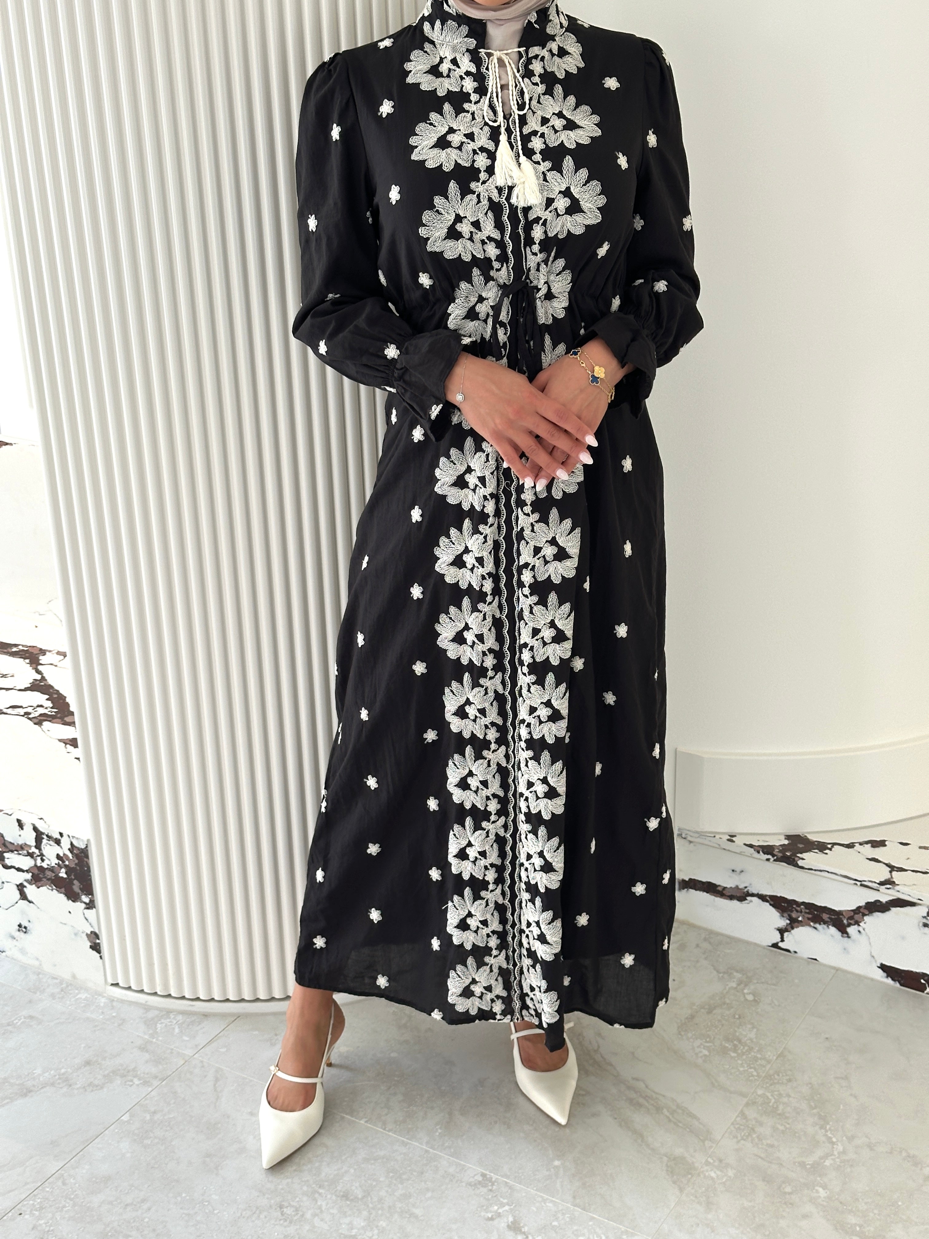 women's modest maxi dress in black and ivory with floral embroidery. dress is lined, long sleeve and lightweight, hijabi friendly and feminine for brunch, party, dinner, events and eid. 