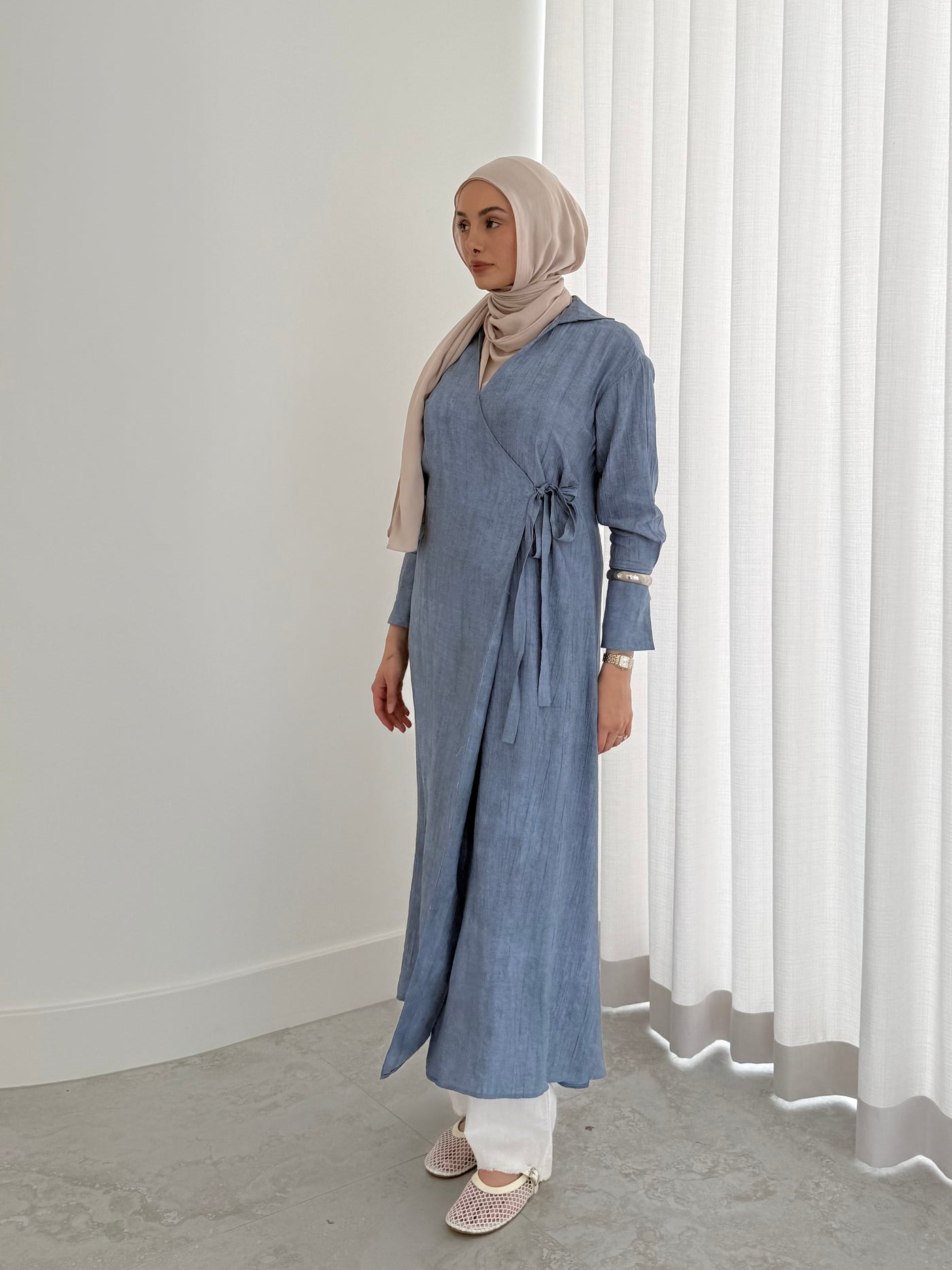 Wrap midi dress in Ocean tone showing skirt drape and mid-length hem