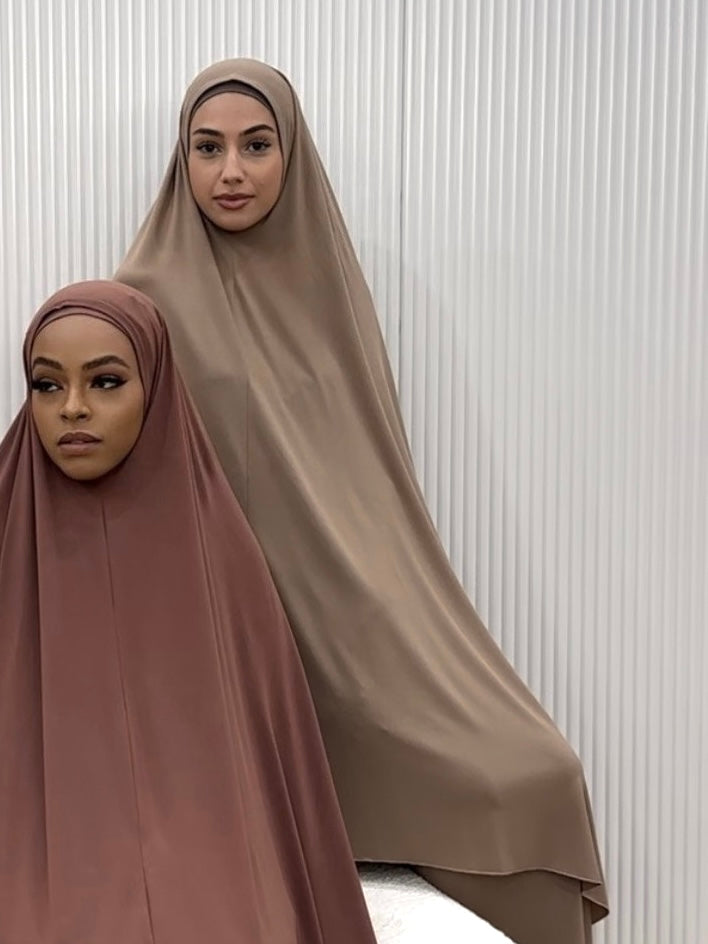 Signature prayer set in a loose, comfortable fabric, featuring a large mocha jilbab and a matching floor-length skirt for full coverage and ease of movement.