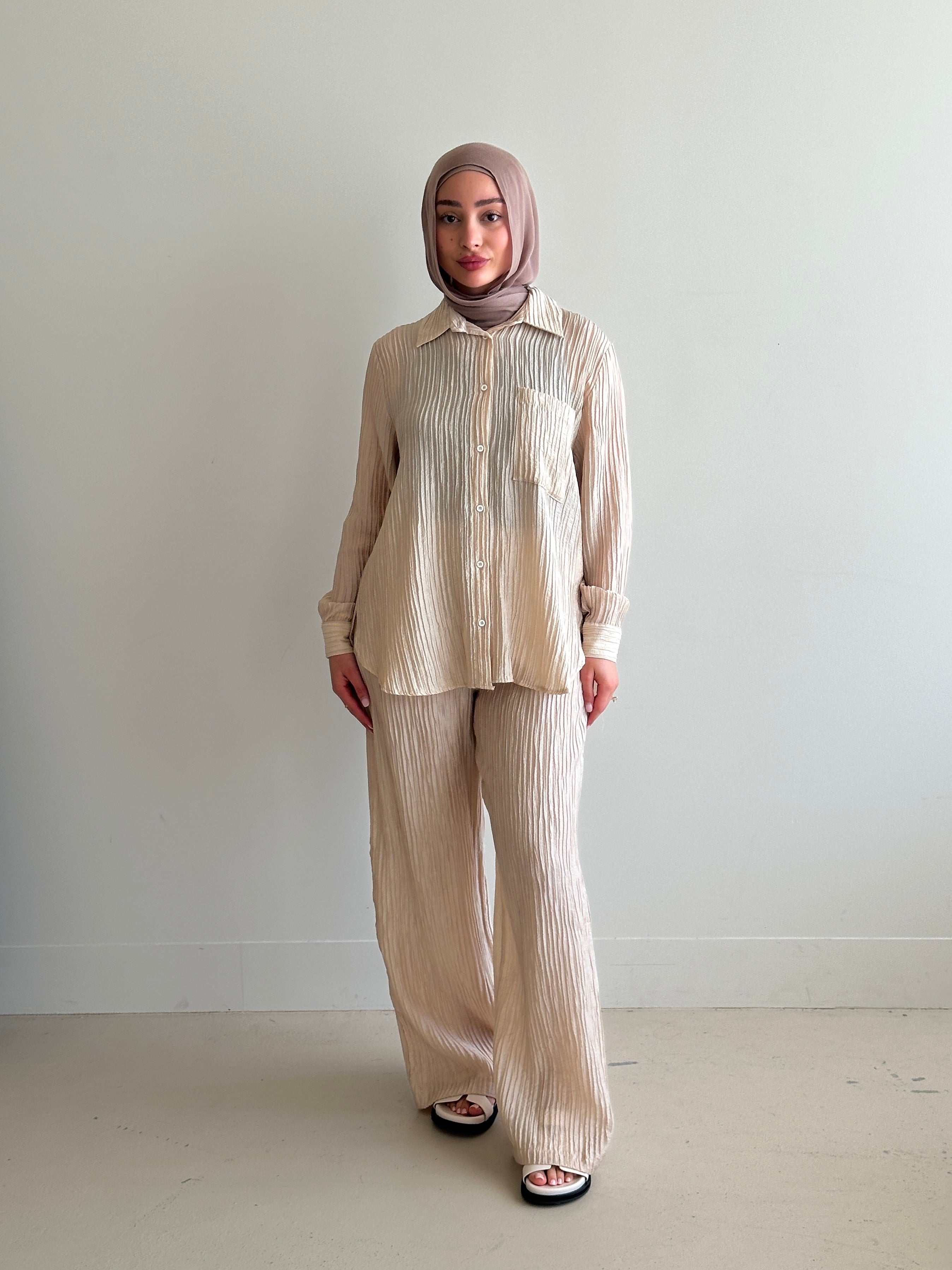 women's 2 piece modest fashion summer set, co-ord includes button up long sleeve shirt with matching loose pant. fabrication is crinkled, lightweight and breathable for summer. can wear it everyday, to work, brunch, picnic and can be transformed to a night outfit to wear with heels and dress it more up for dinner dates. 