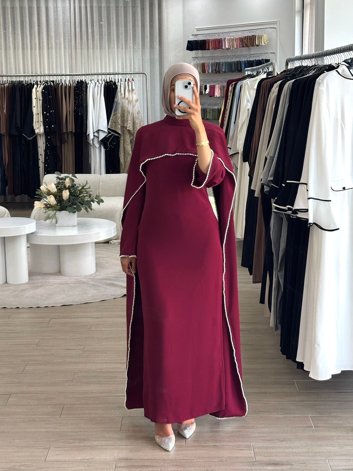 women's formal dress in deep red featuring delicate pearl embellishments and a flowing modest silhouette, perfect for formal occasions.