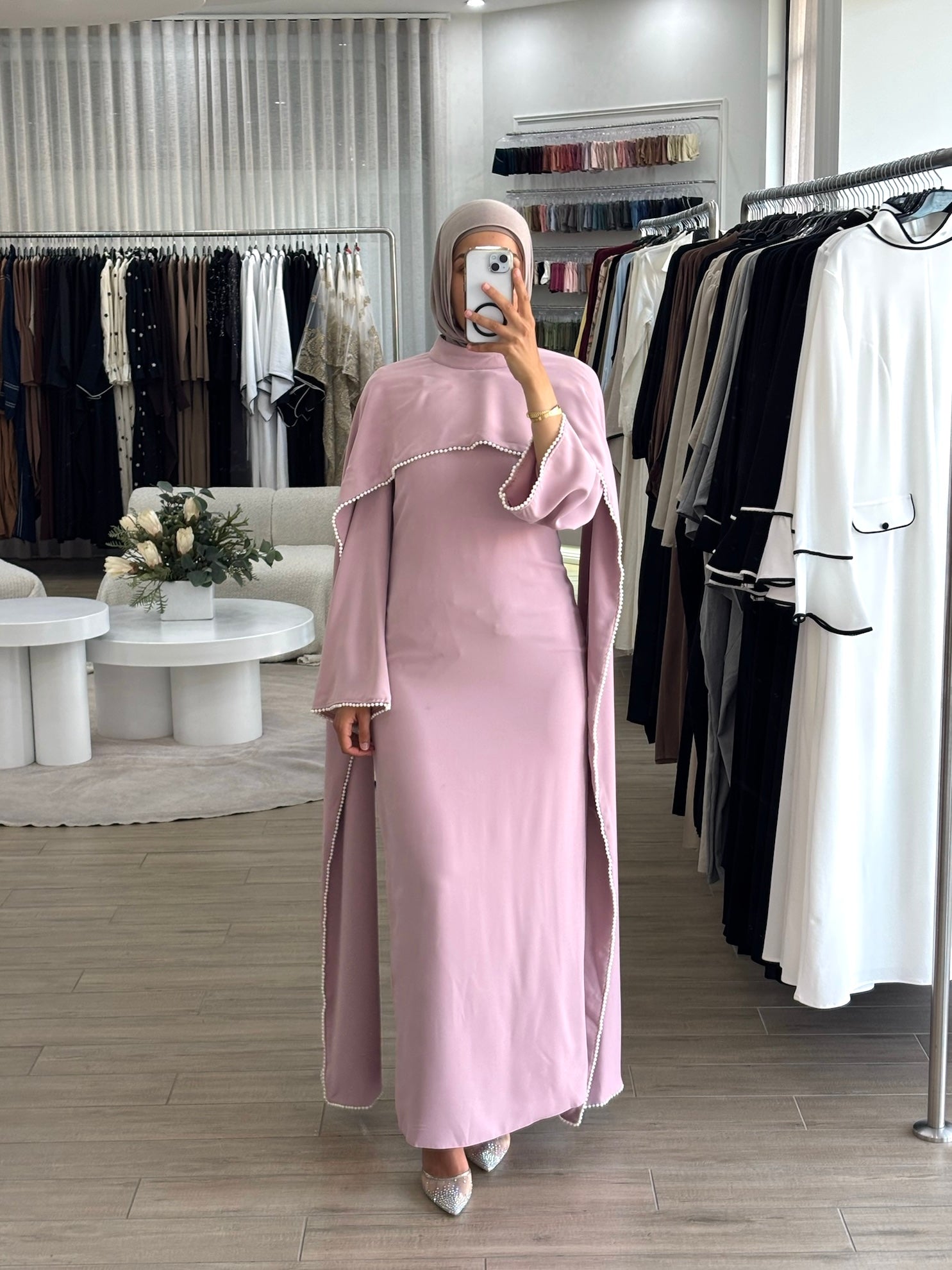 women's formal dress in soft pink featuring delicate pearl embellishments and a flowing modest silhouette, perfect for formal occasions.