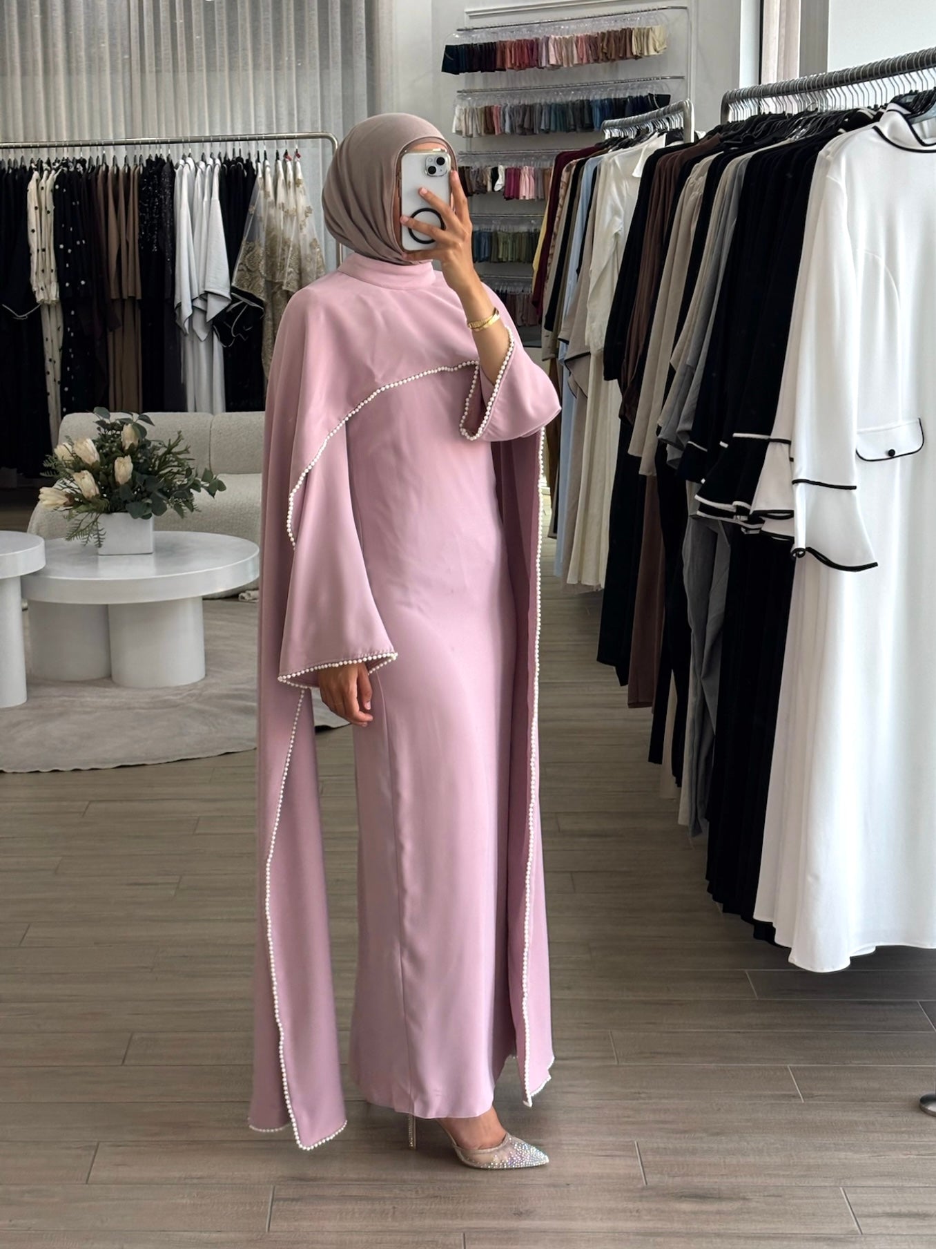 women's formal dress in soft pink featuring delicate pearl embellishments and a flowing modest silhouette, perfect for formal occasions.