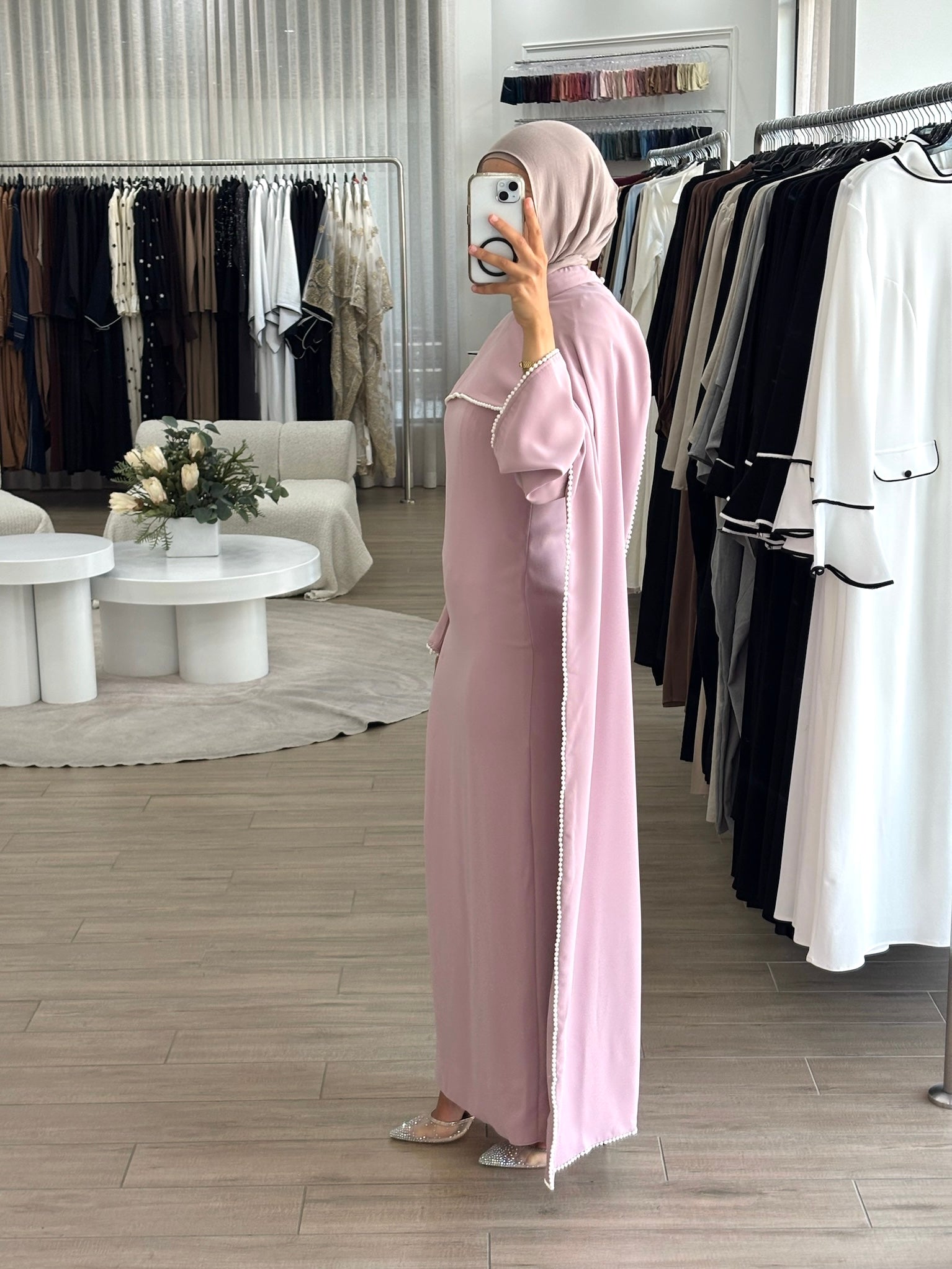 women's formal dress in soft pink featuring delicate pearl embellishments and a flowing modest silhouette, perfect for formal occasions.