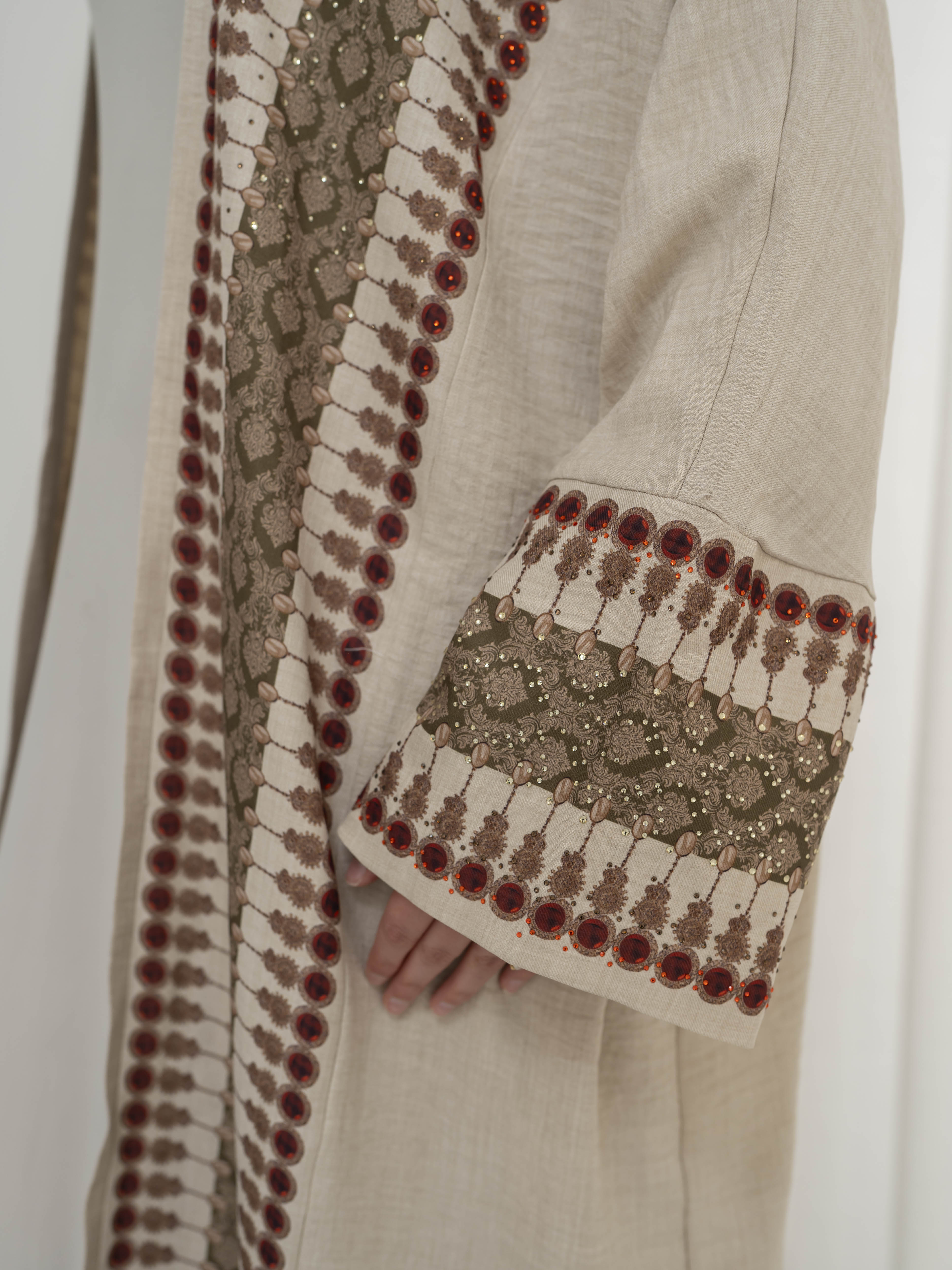 Model wearing the Andalus open abaya with an intricate patterned fabric and subtle embellishments, styled open for a modest and elegant look suitable for Ramadan and Eid.