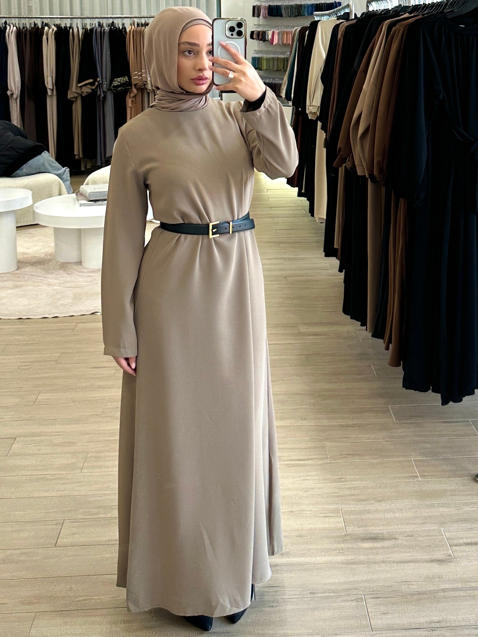 Basic Abaya in a classic straight-cut maxi silhouette with long sleeves and a round neckline. Minimalist design offers modest, polished elegance suitable for everyday wear or special occasions.