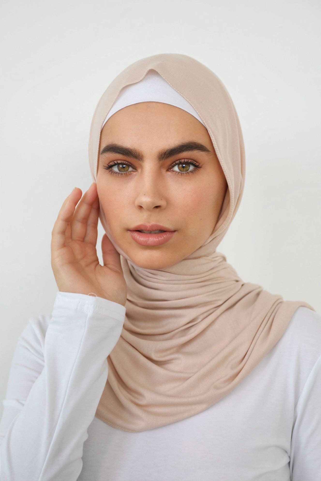 Signature jersey scarf made from soft, stretchy cotton with an extended length for easy wrapping and a secure, comfortable fit around the head.