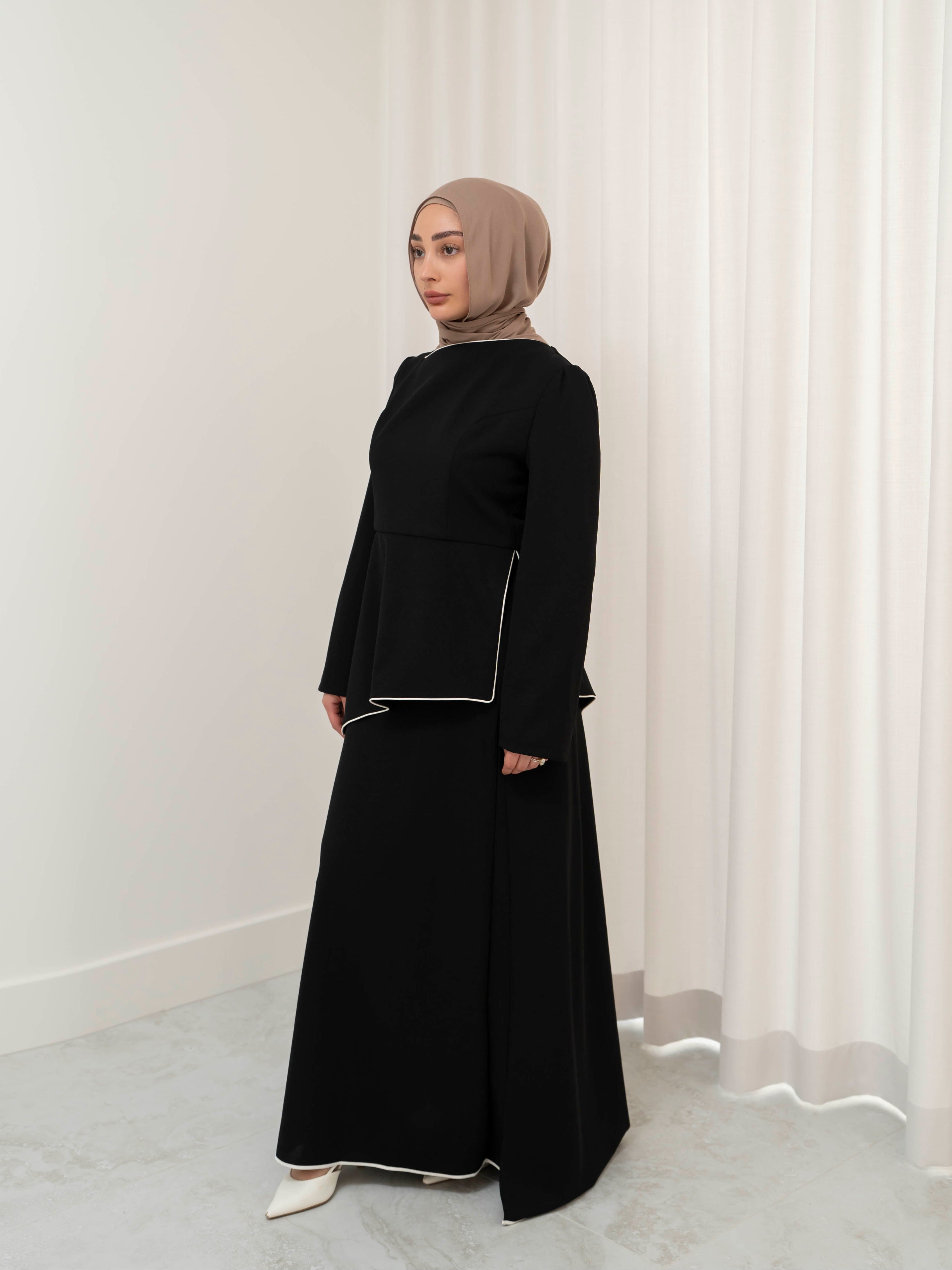 Two-piece modest set with a structured top and coordinating draped bottom, creating a flattering, elongated silhouette. Polished yet comfortable, perfect for special occasions or all-day wear.