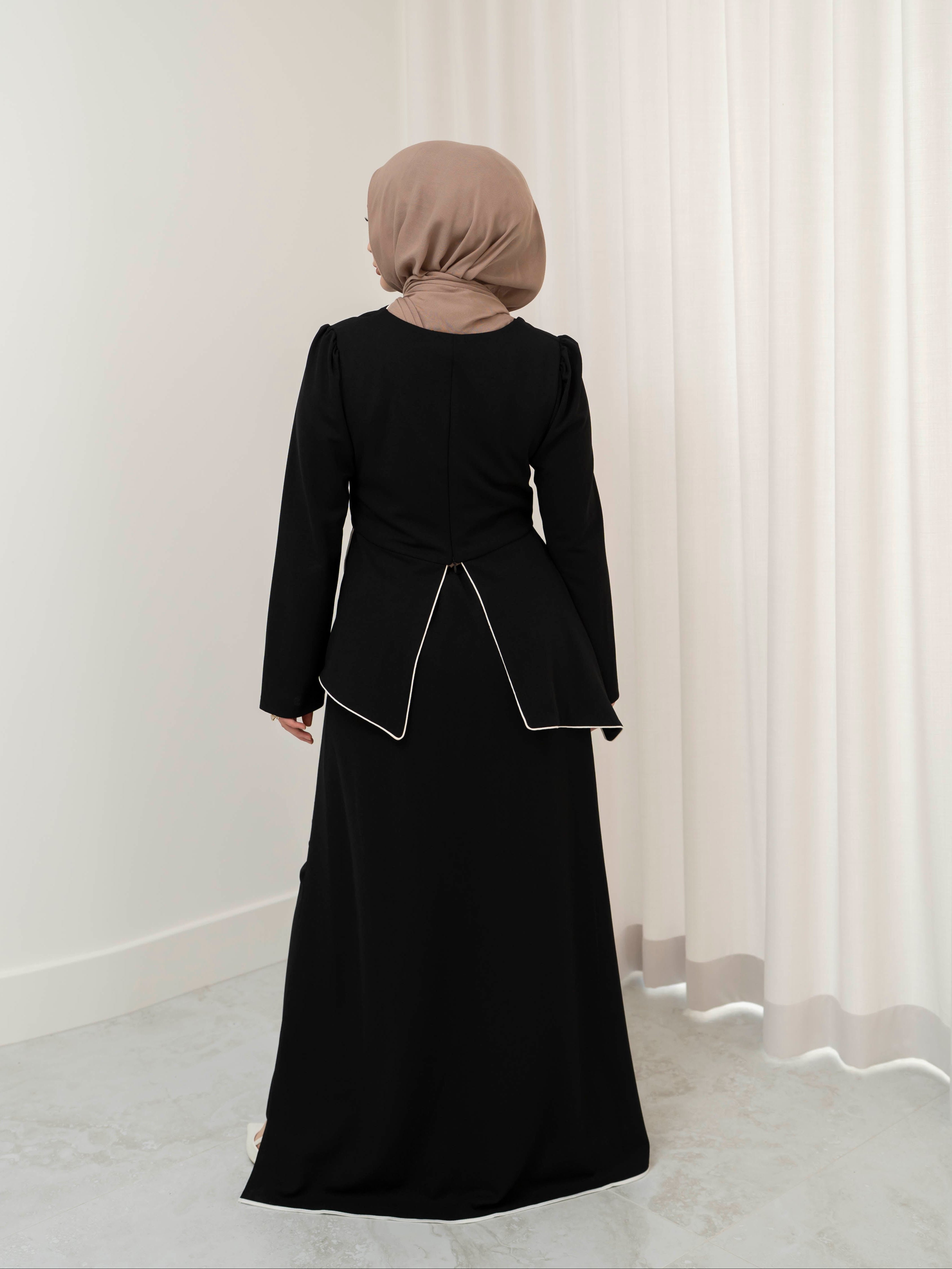 Two-piece modest set with a structured top and coordinating draped bottom, creating a flattering, elongated silhouette. Polished yet comfortable, perfect for special occasions or all-day wear.