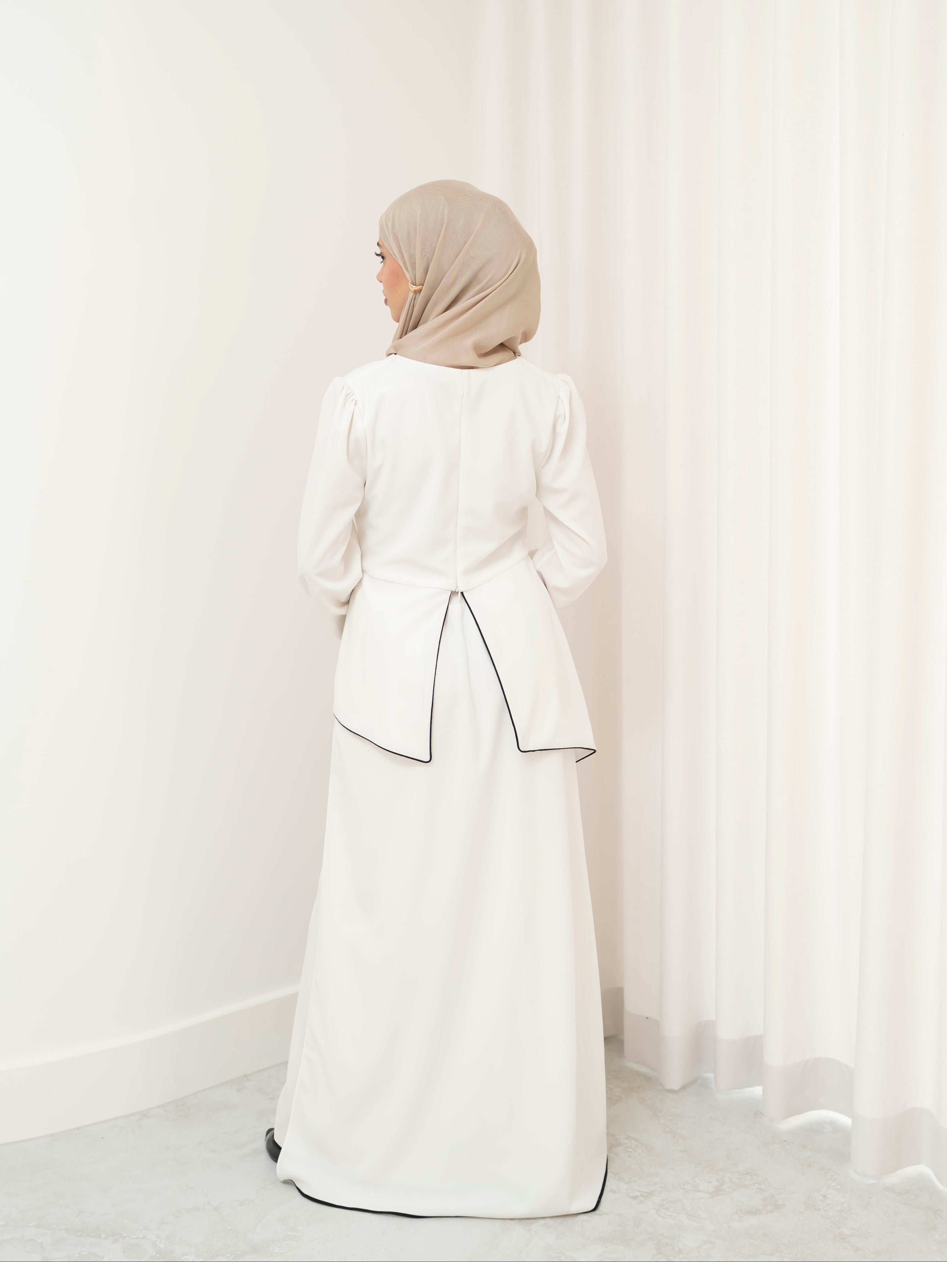 Two-piece modest set with a structured top and coordinating draped bottom, creating a flattering, elongated silhouette. Polished yet comfortable, perfect for special occasions or all-day wear.
