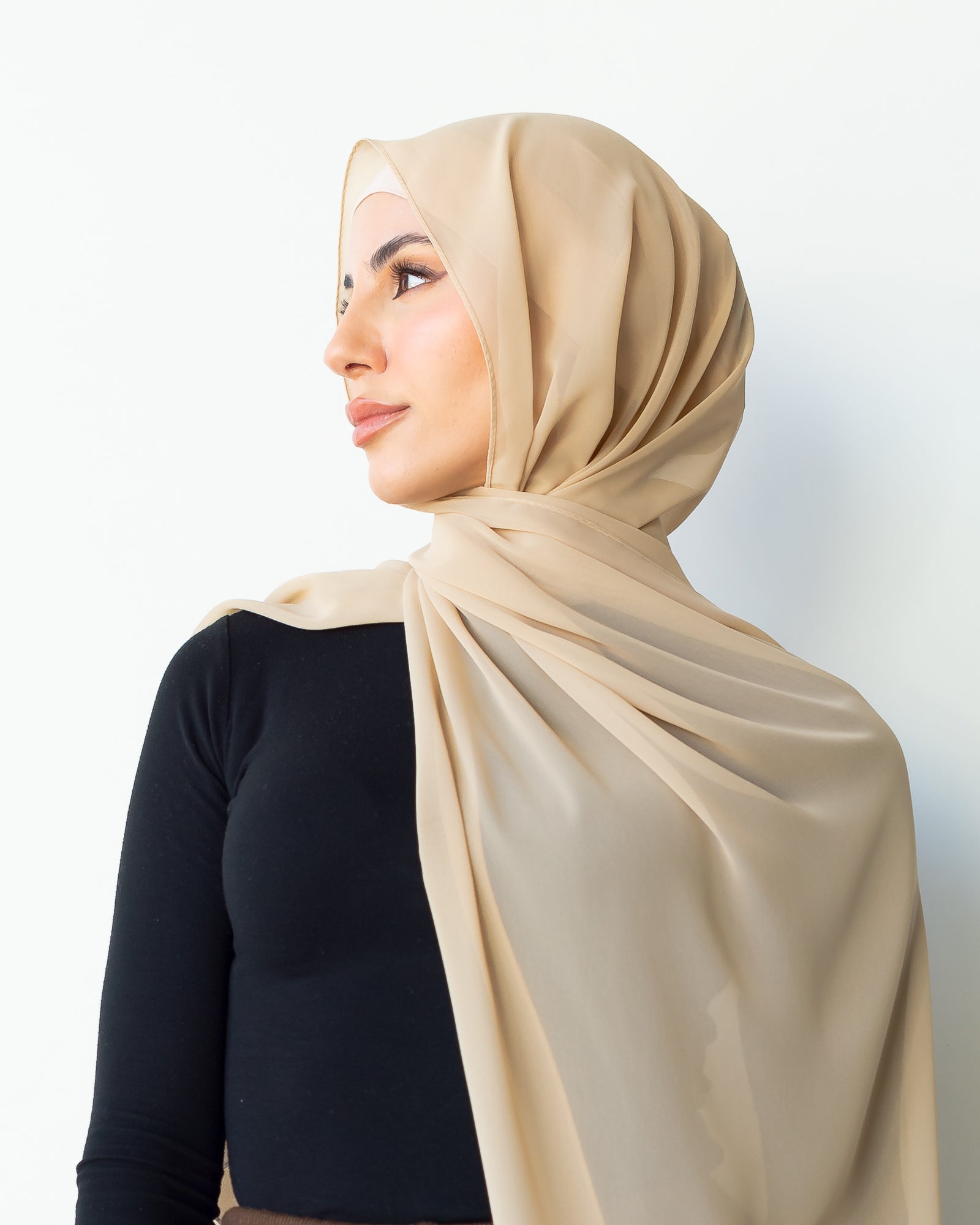 Chiffon shawl with rolled stitch. Made from 100% polyester