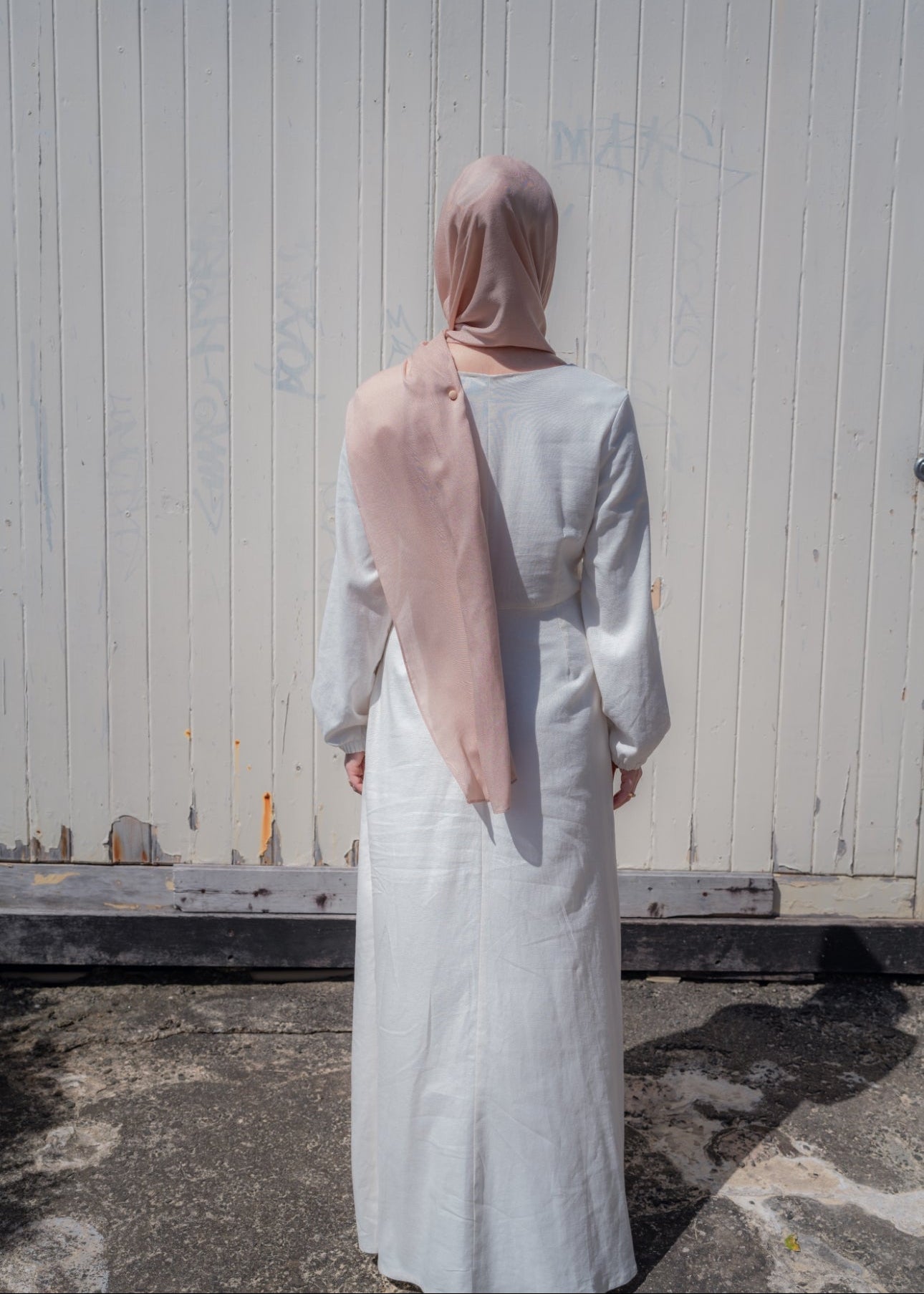 Ivory linen maxi dress with an A-line skirt and empire waist for a flattering silhouette. Features a round neckline and long balloon sleeves for an elegant touch. Lightweight and breathable, ideal for warm-weather wear and summer occasions.