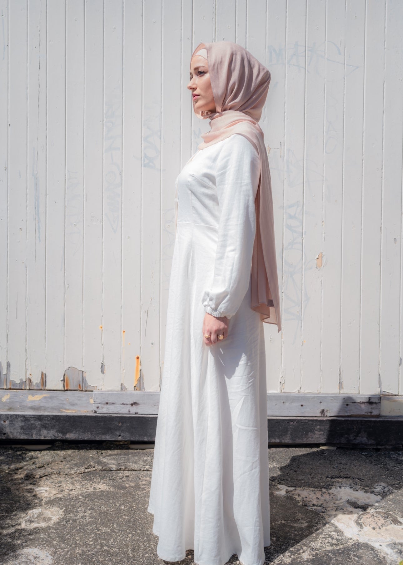 Ivory linen maxi dress with an A-line skirt and empire waist for a flattering silhouette. Features a round neckline and long balloon sleeves for an elegant touch. Lightweight and breathable, ideal for warm-weather wear and summer occasions.