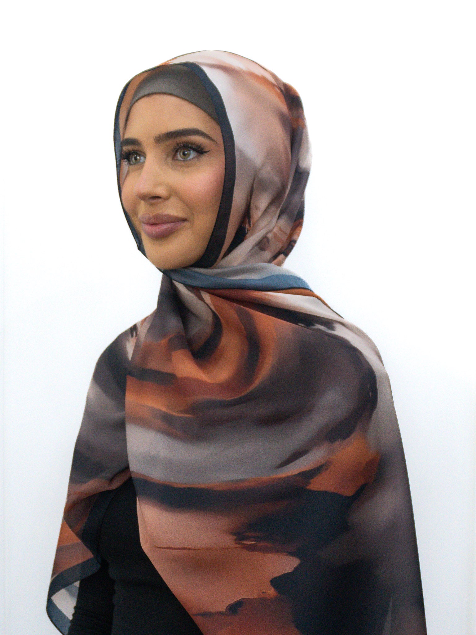Silk Look printed hijab in lightweight satin-finish polyester with abstract border design, 68cm x 190cm.