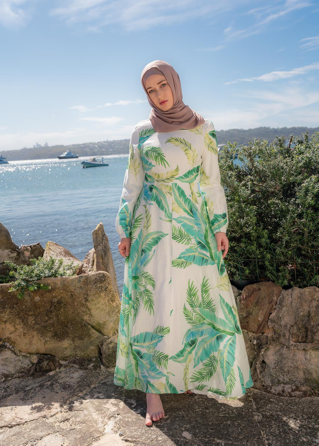 Made with bright and uplifting hues, the EVERGREEN ESCAPE DRESS, is the perfect number for your next holiday. Like our signature Amira Linen Dress, except this one features a tropical inspired leafy print. 