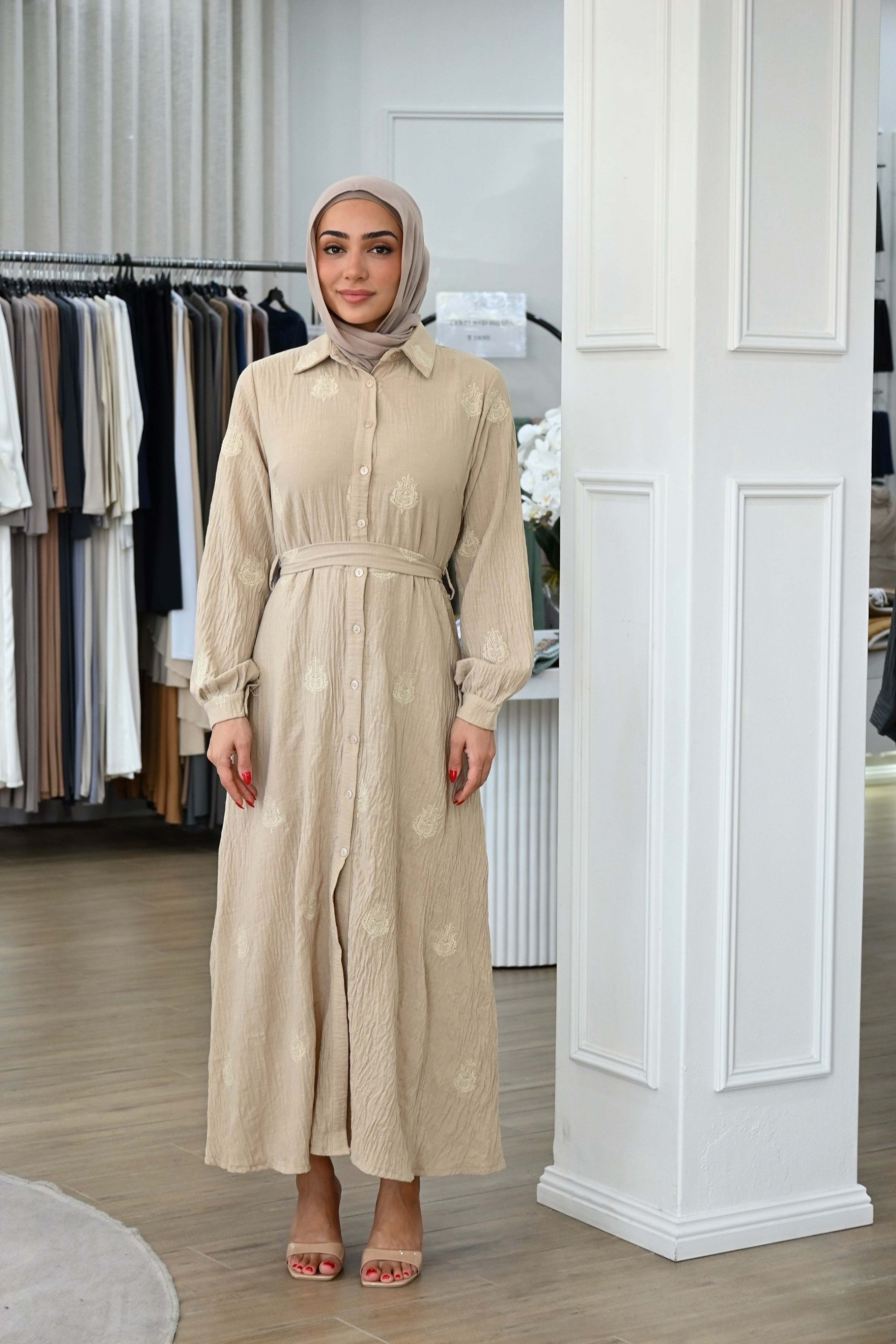 This embroidered shirt dress is designed for comfort without compromising on style. Crafted from a lightweight, breathable fabric, it features delicate tonal embroidery throughout for a refined, elevated finish