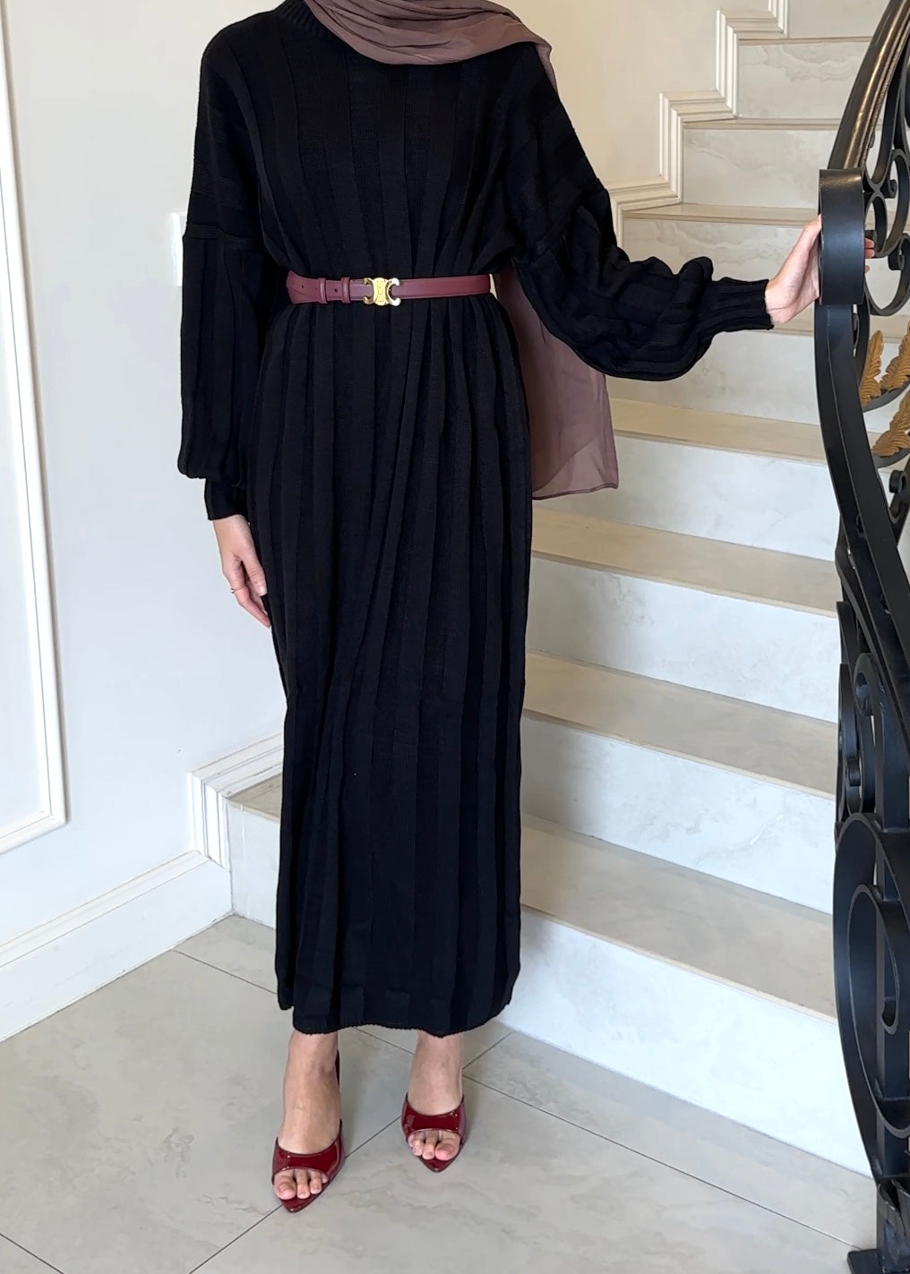 Crafted from a soft knit material, this dress features long ribbing panels and a relaxed fit for ultimate comfort. The long drop sleeves and fitted cuffs add a touch of style, while the ankle length design provides coverage. Stay cozy and stylish all season long.