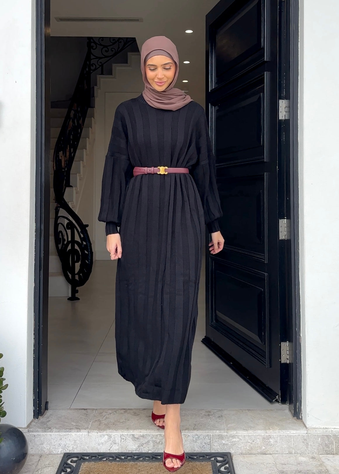 Crafted from a soft knit material, this dress features long ribbing panels and a relaxed fit for ultimate comfort. The long drop sleeves and fitted cuffs add a touch of style, while the ankle length design provides coverage. Stay cozy and stylish all season long.