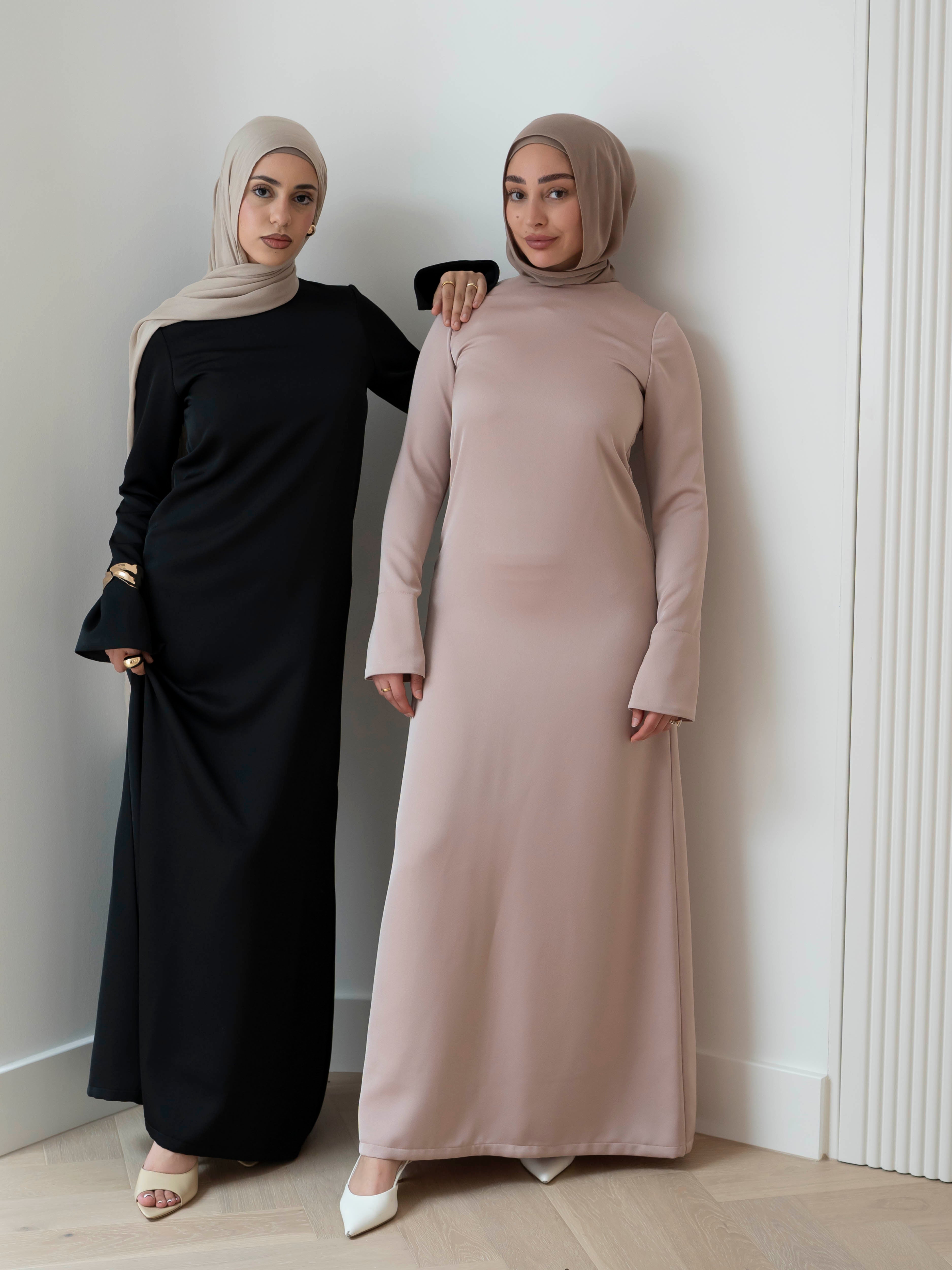 Lumière Satin Dress in smooth, fully lined satin with a soft sheen, featuring a modest, timeless cut and fluid drape that creates an elegant silhouette. Ideal for formal events, evening occasions, and special celebrations.