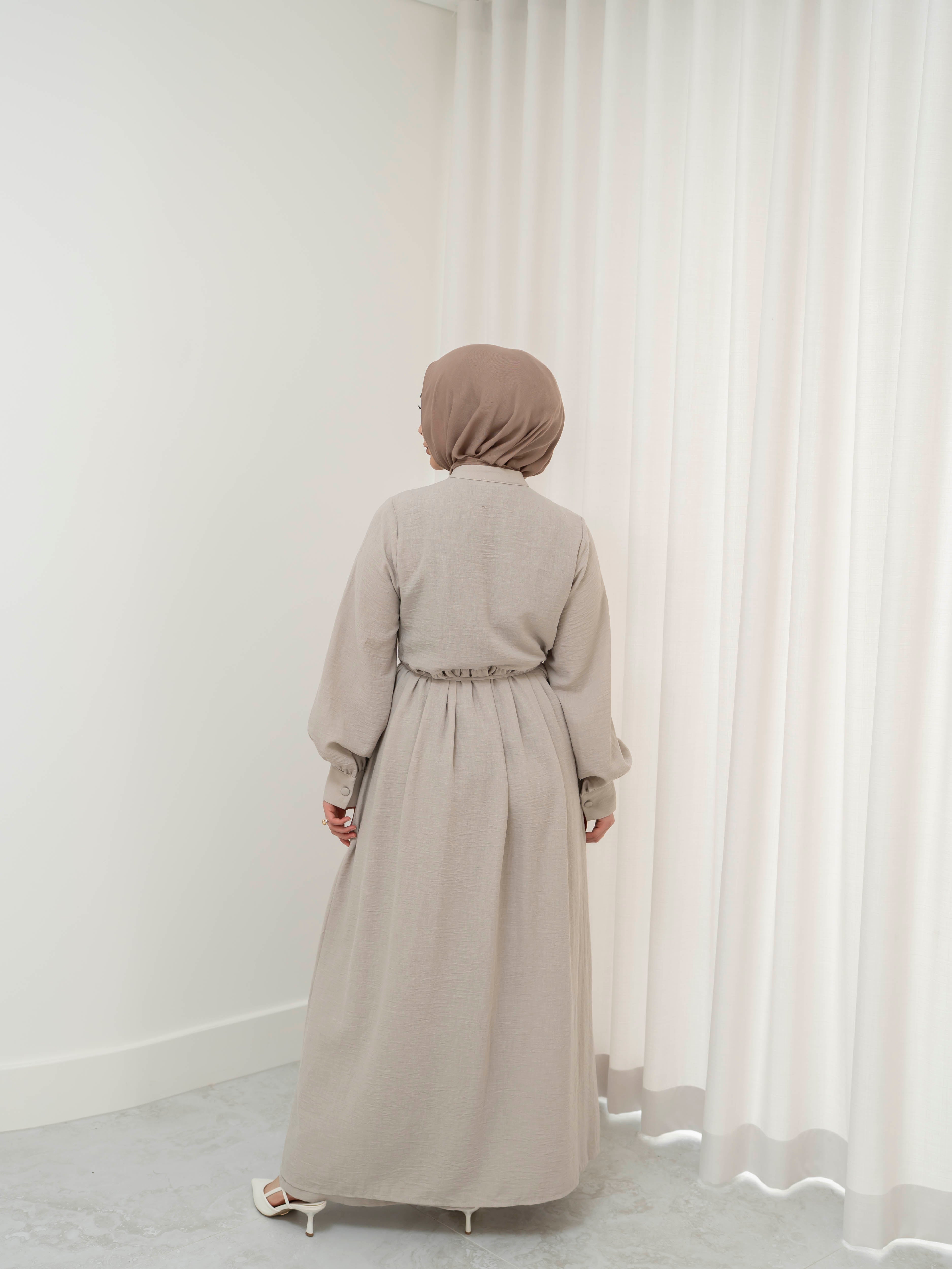 Luna Dress & Pant Set, a two-piece outfit featuring a flowing button-front dress with adjustable waist tie and matching high-waisted pants with elastic waistband and side pockets. Long sleeves with cuffs, lightweight fabric with elegant drape, designed for modest, polished looks suitable for Eid, special occasions, or everyday wear.