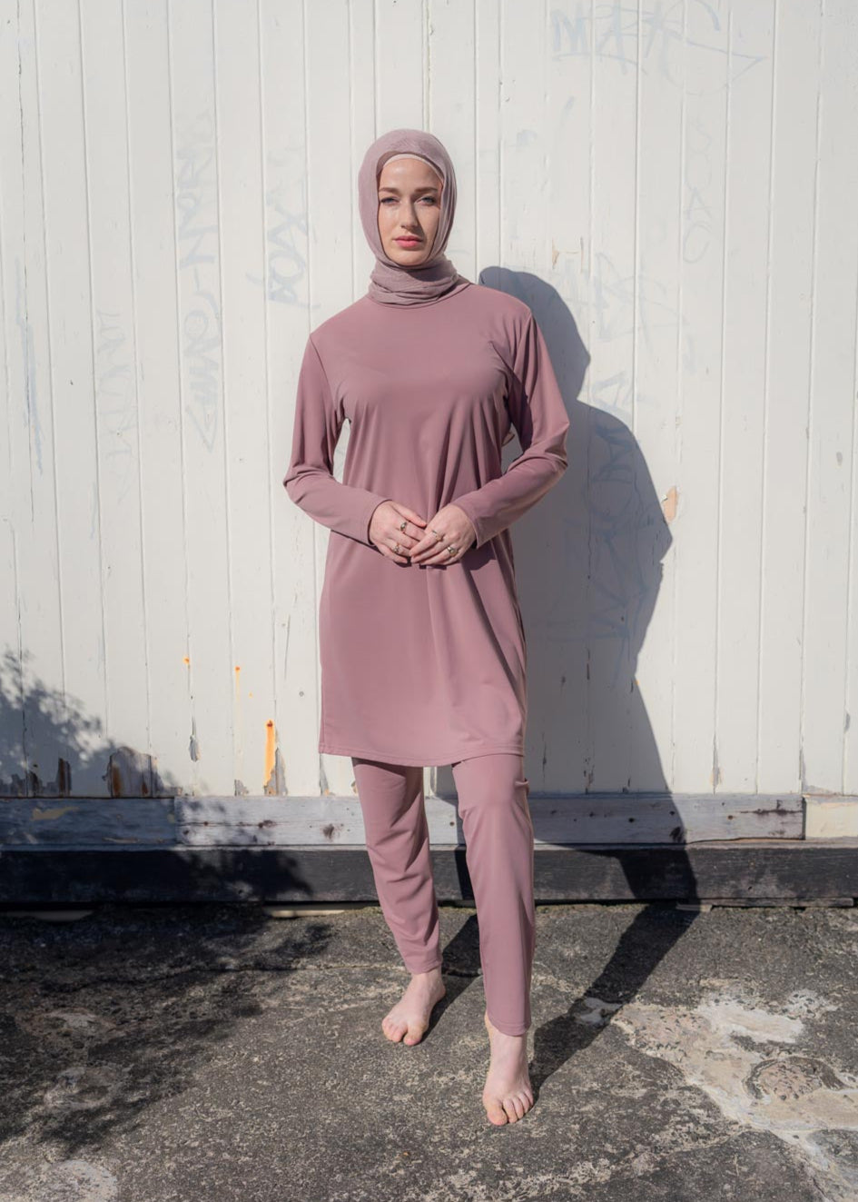 Stay classy and modest this summer in the Marina swimwear set. Available in black and mauve- it's made up of a loose trouser with elasticated waistline and a long sleeve top that reaches above the knee.