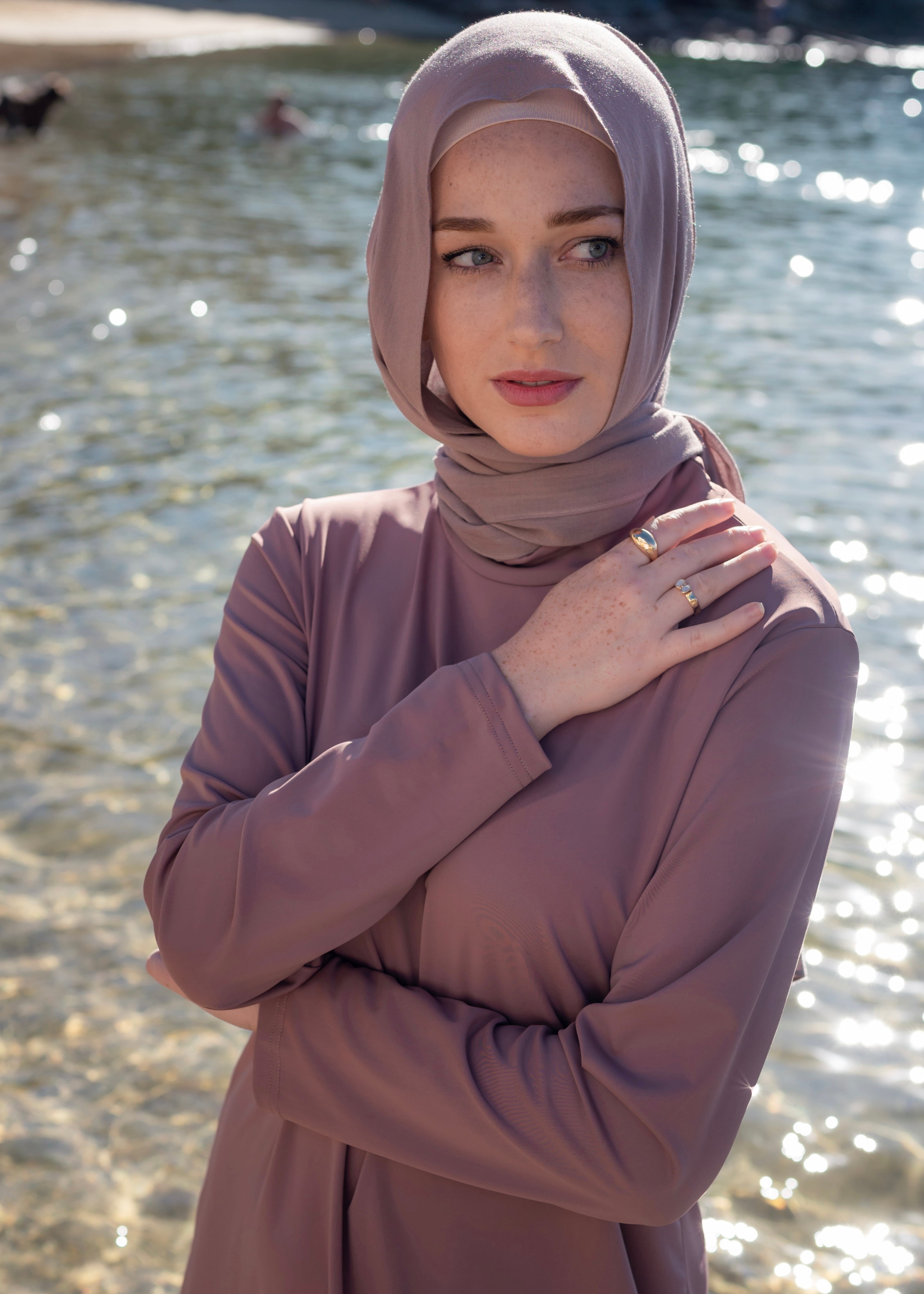 Stay classy and modest this summer in the Marina swimwear set. Available in black and mauve- it's made up of a loose trouser with elasticated waistline and a long sleeve top that reaches above the knee.