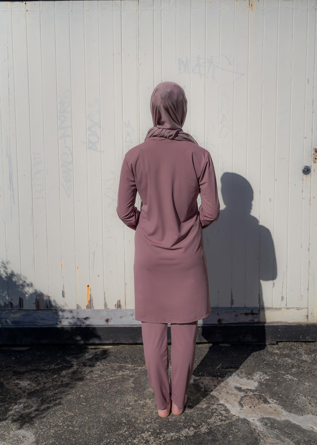Stay classy and modest this summer in the Marina swimwear set. Available in black and mauve- it's made up of a loose trouser with elasticated waistline and a long sleeve top that reaches above the knee.