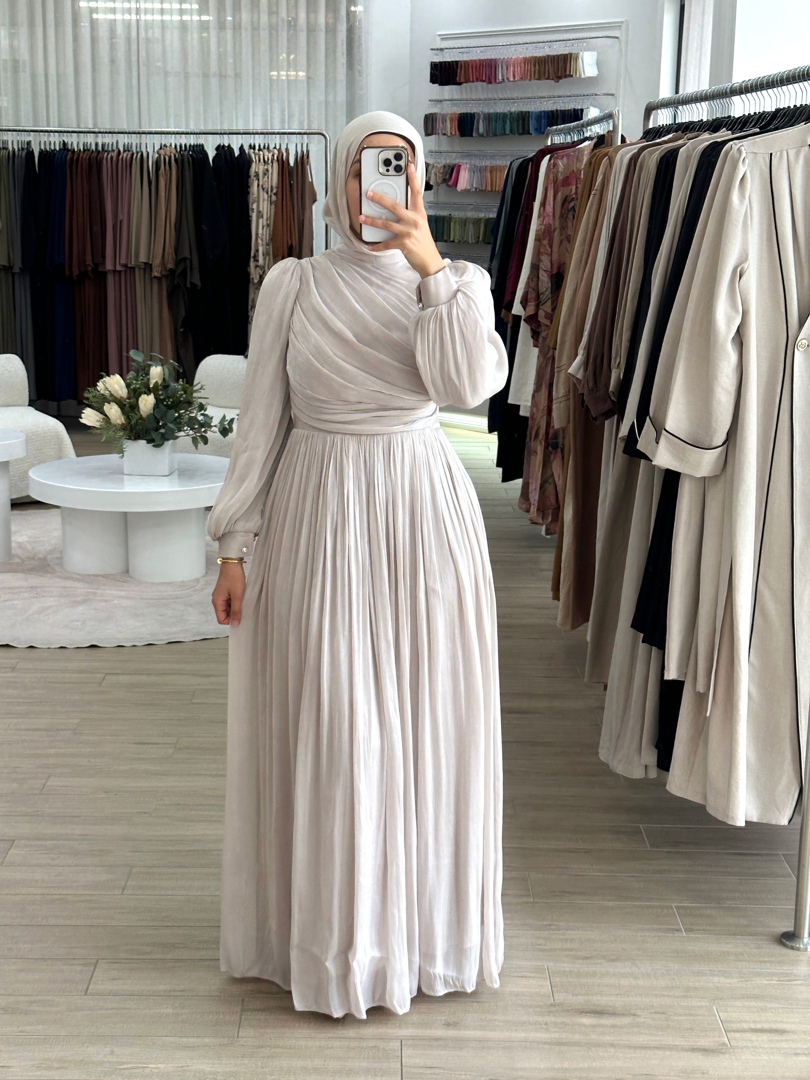 The Metallic Ruche Dress is our dreamy pick of the season! Woven from a luminescent metallic fabric, it's shaped with a high neck and artful gathers that drape asymmetrically around the bodice for a flattering fit.