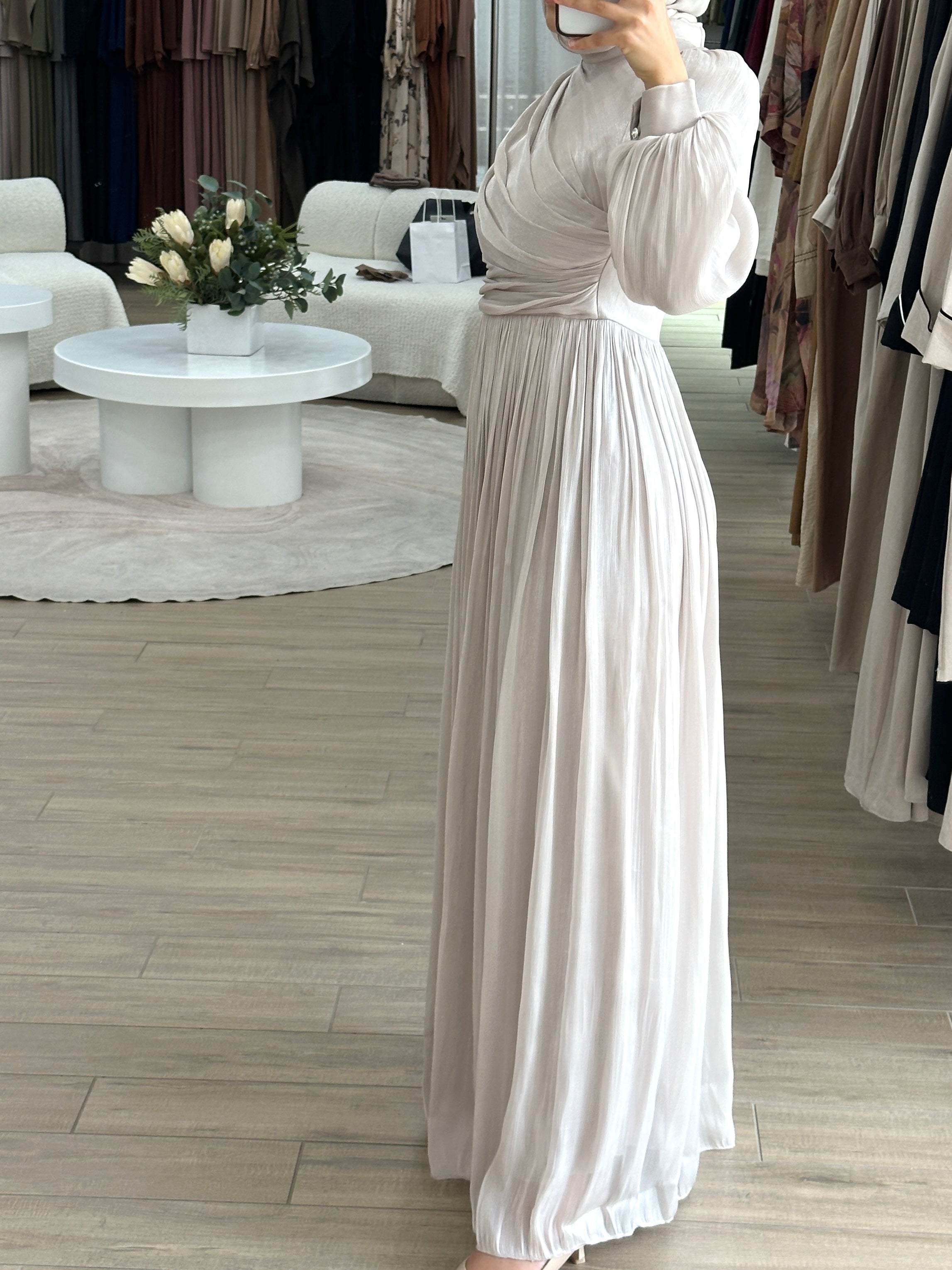 The Metallic Ruche Dress is our dreamy pick of the season! Woven from a luminescent metallic fabric, it's shaped with a high neck and artful gathers that drape asymmetrically around the bodice for a flattering fit.