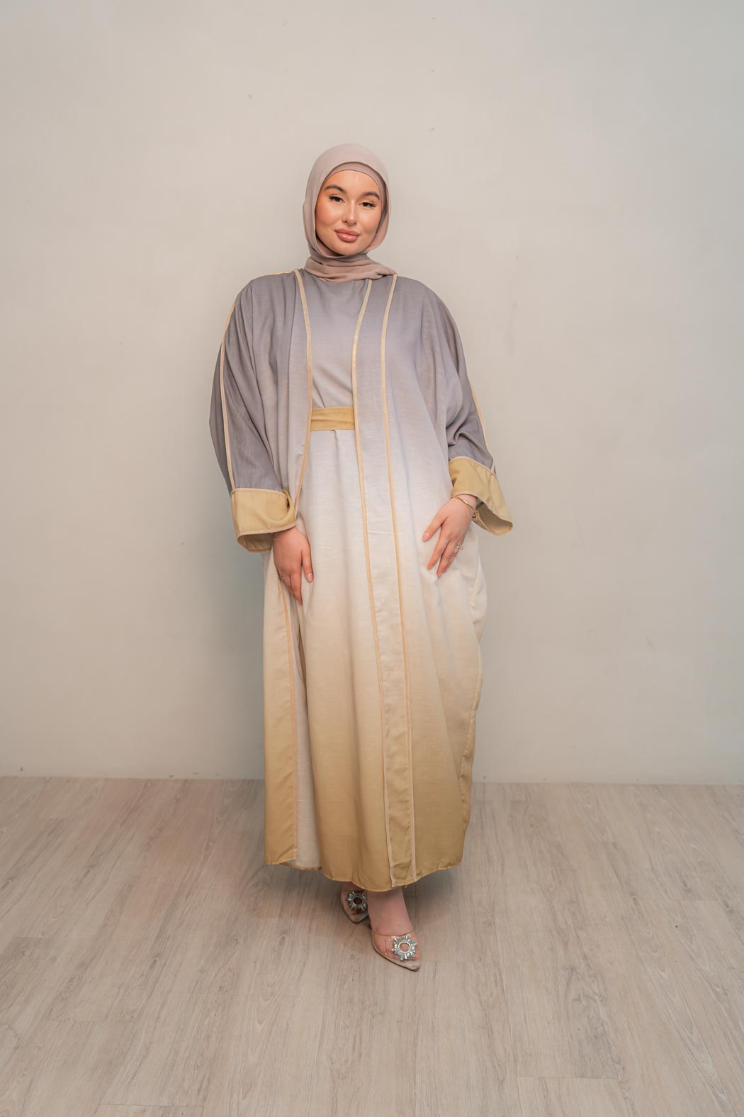 The stunning kaftan dress and tonal dress underlay provide versatility and comfort, while the lace tie neckline adds a feminine touch. Perfect for social occasions and functions, this set will be on high rotation in your wardrobe.