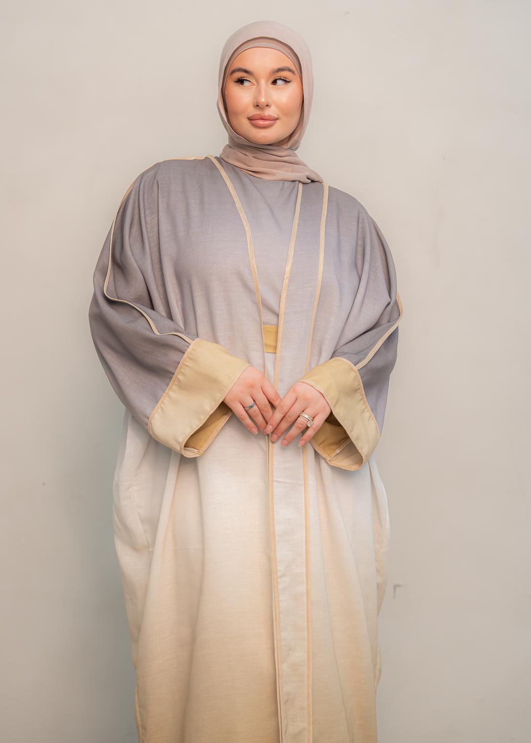 The stunning kaftan dress and tonal dress underlay provide versatility and comfort, while the lace tie neckline adds a feminine touch. Perfect for social occasions and functions, this set will be on high rotation in your wardrobe.