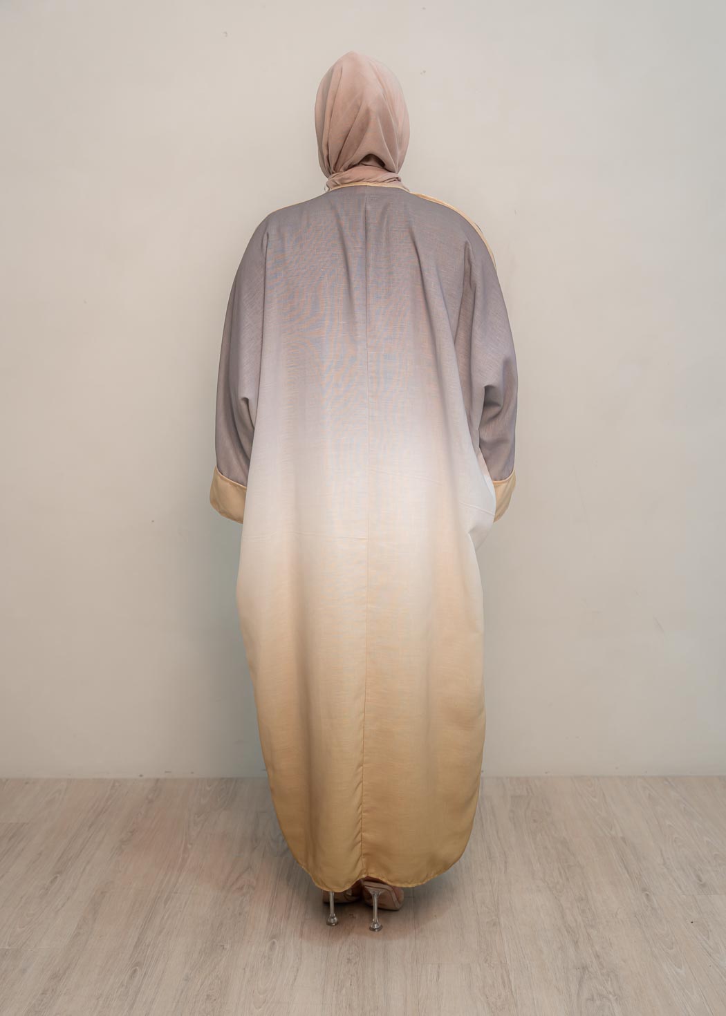 The stunning kaftan dress and tonal dress underlay provide versatility and comfort, while the lace tie neckline adds a feminine touch. Perfect for social occasions and functions, this set will be on high rotation in your wardrobe.