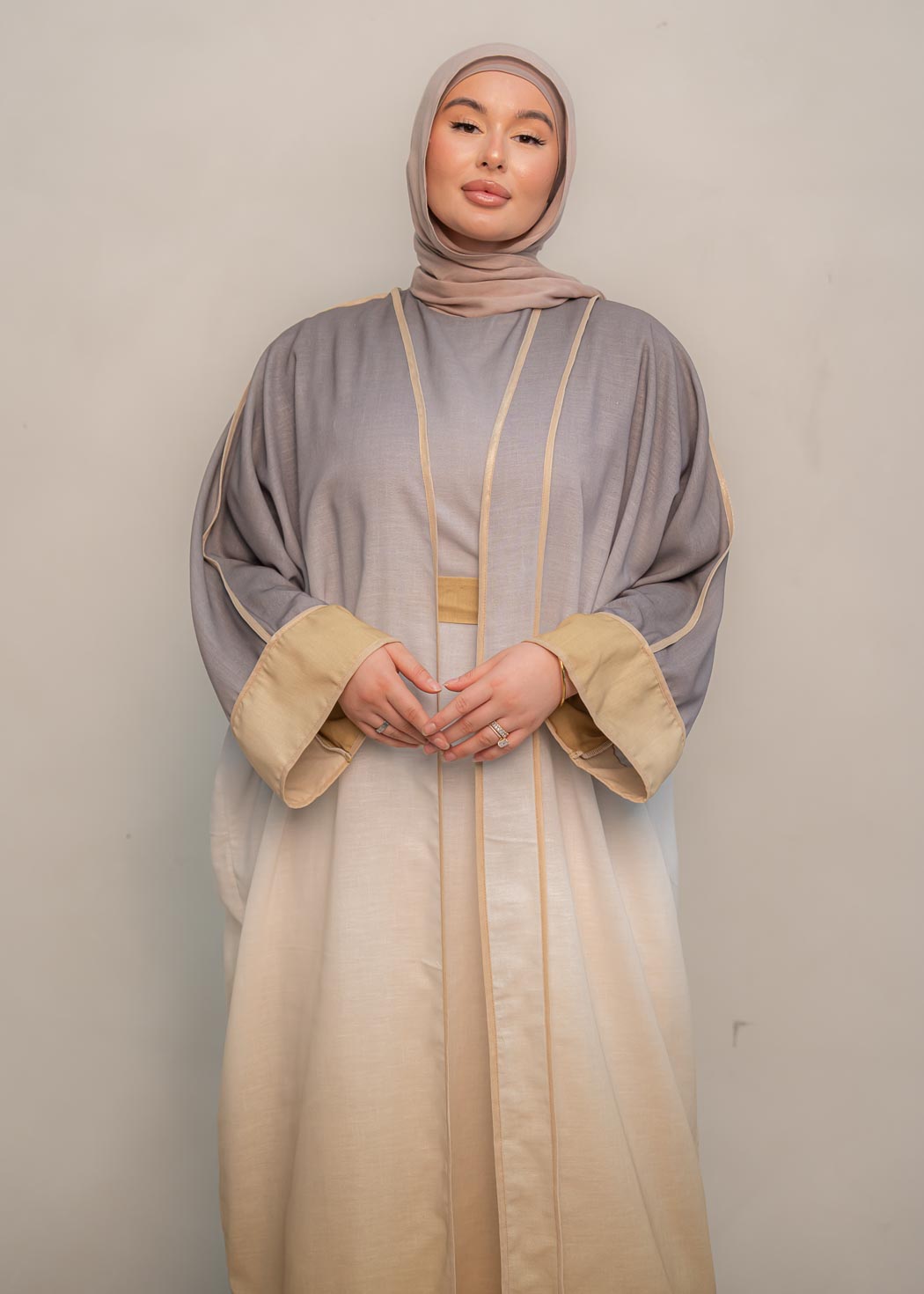 The stunning kaftan dress and tonal dress underlay provide versatility and comfort, while the lace tie neckline adds a feminine touch. Perfect for social occasions and functions, this set will be on high rotation in your wardrobe.