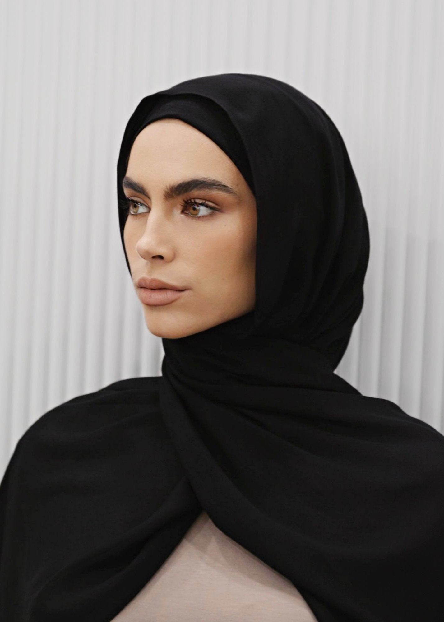 Premium Modal Hijab in a warm, spice-inspired tone, measuring 190cm x 60cm with a single stitch edge. Lightweight and breathable with a soft, elegant drape, offering near opaque coverage for comfortable everyday or occasion wear