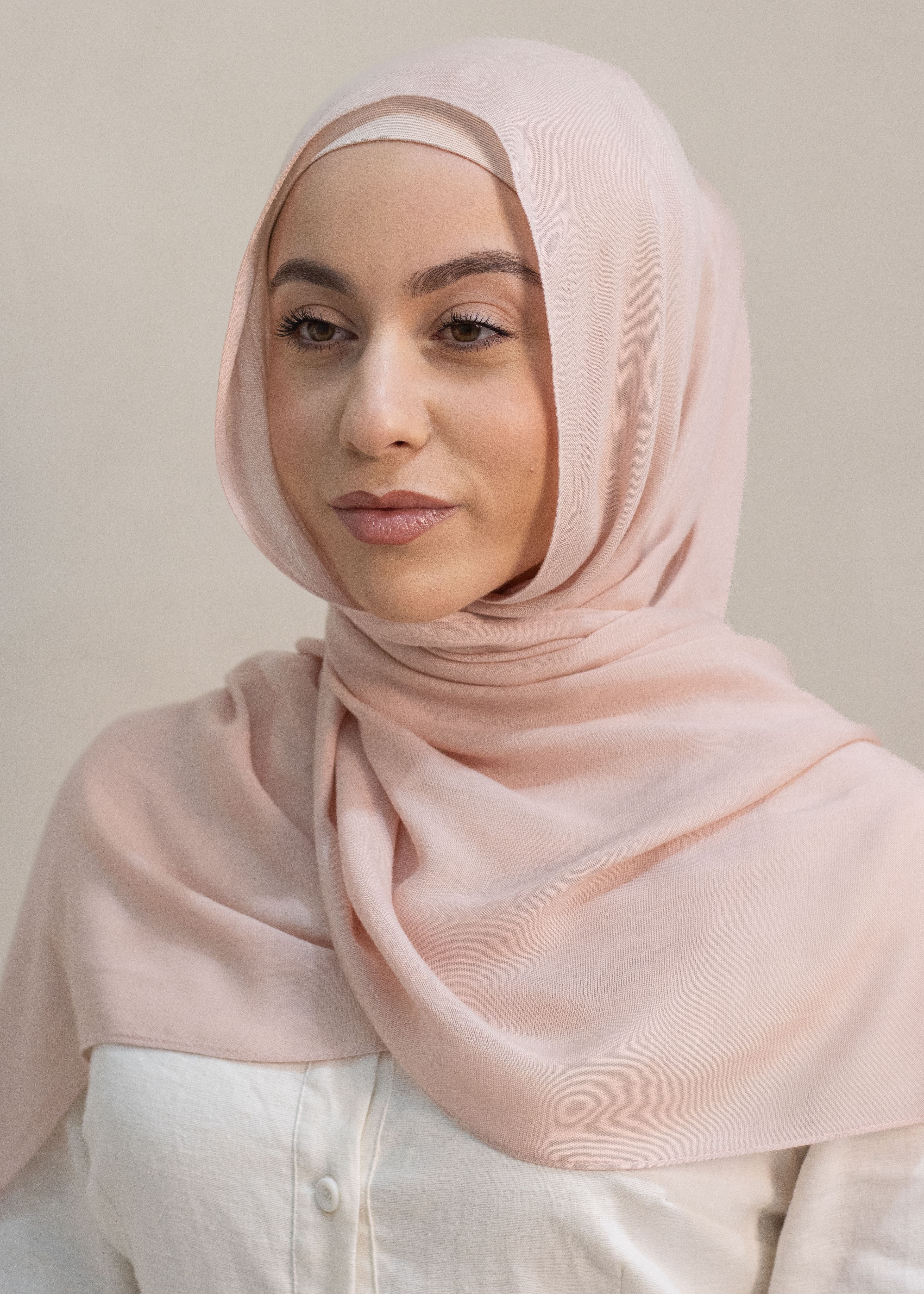 Crafted with the softest fabric, each hijab provides a beautiful drape that falls effortlessly, ensuring a refined look for everyday or for any occasion. The material is designed to be almost non-see through, offering excellent coverage while maintaining a lightweight, breathable feel. Perfect for those seeking a blend of style, comfort and modesty.