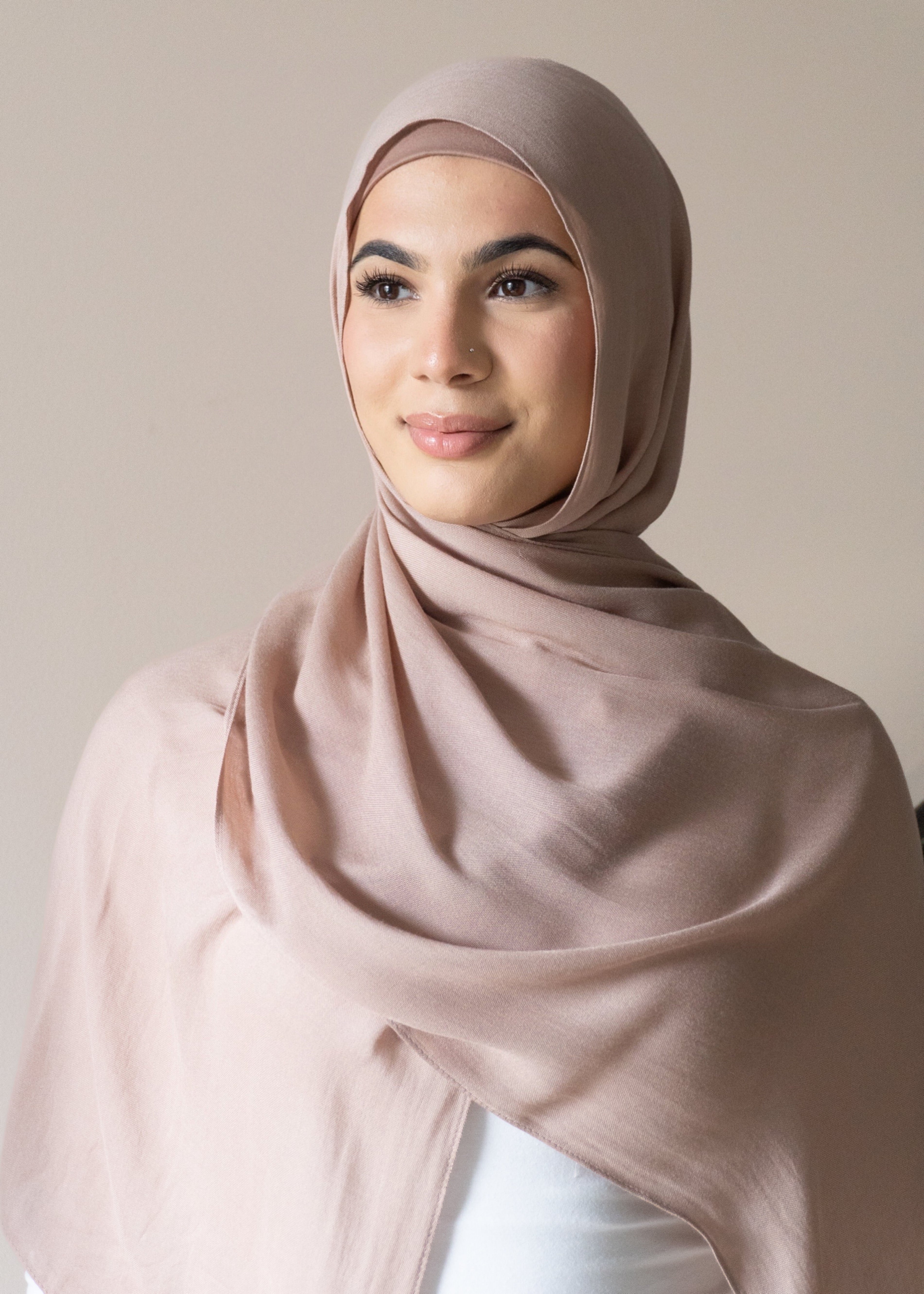 The material is designed to be almost non-see through, offering excellent coverage while maintaining a lightweight, breathable feel. Perfect for those seeking a blend of style, comfort and modesty.