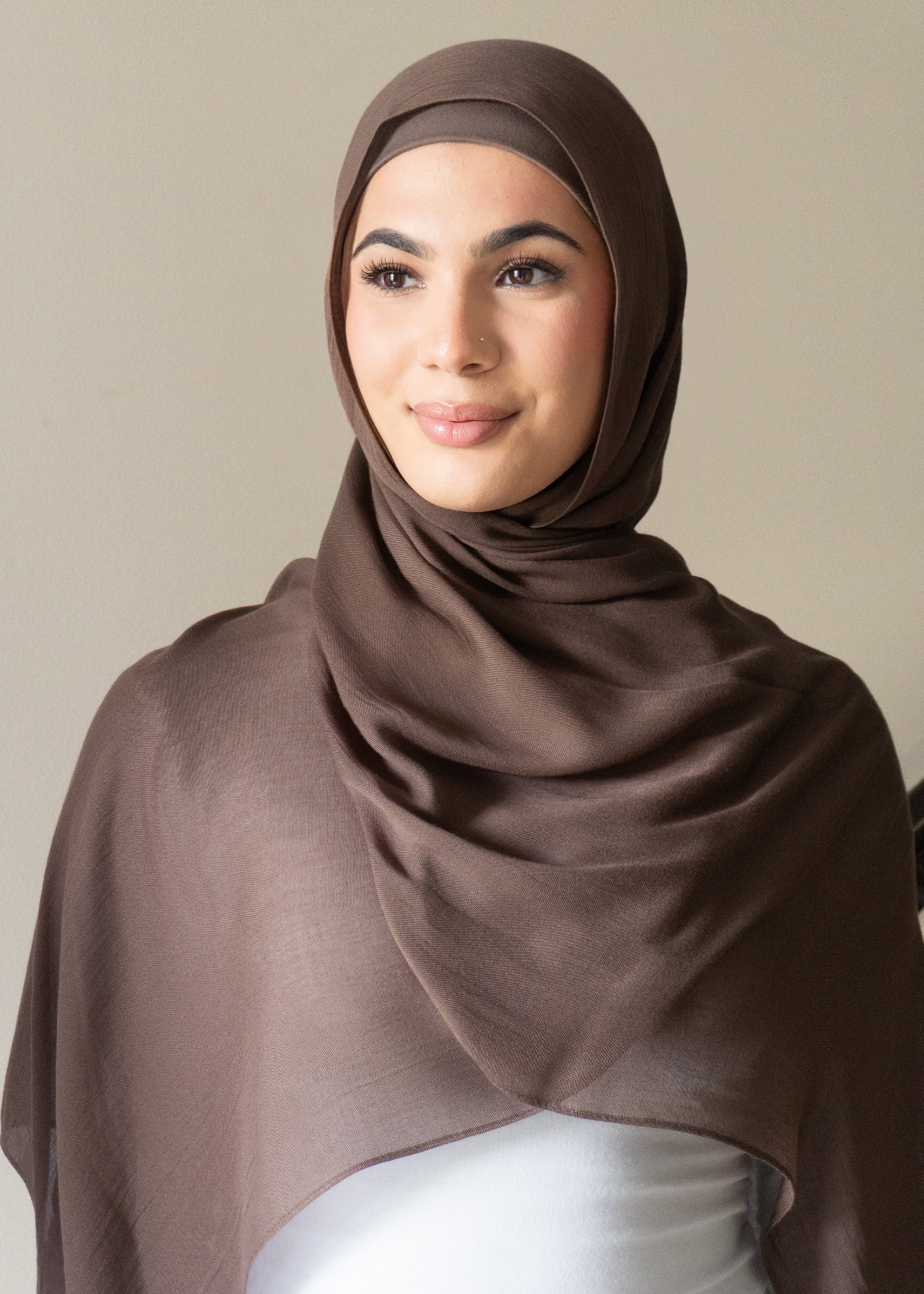 The material is designed to be almost non-see through, offering excellent coverage while maintaining a lightweight, breathable feel. Perfect for those seeking a blend of style, comfort and modesty.