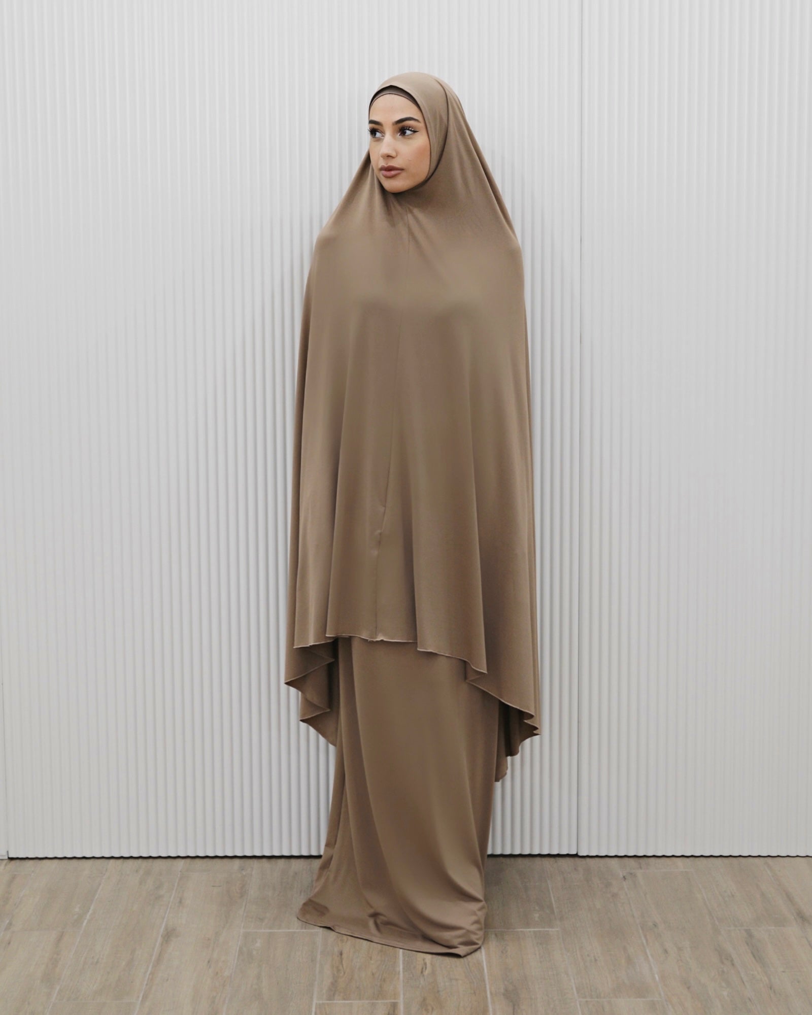 Signature prayer set in a loose, comfortable fabric, featuring a large mocha jilbab and a matching floor-length skirt for full coverage and ease of movement.