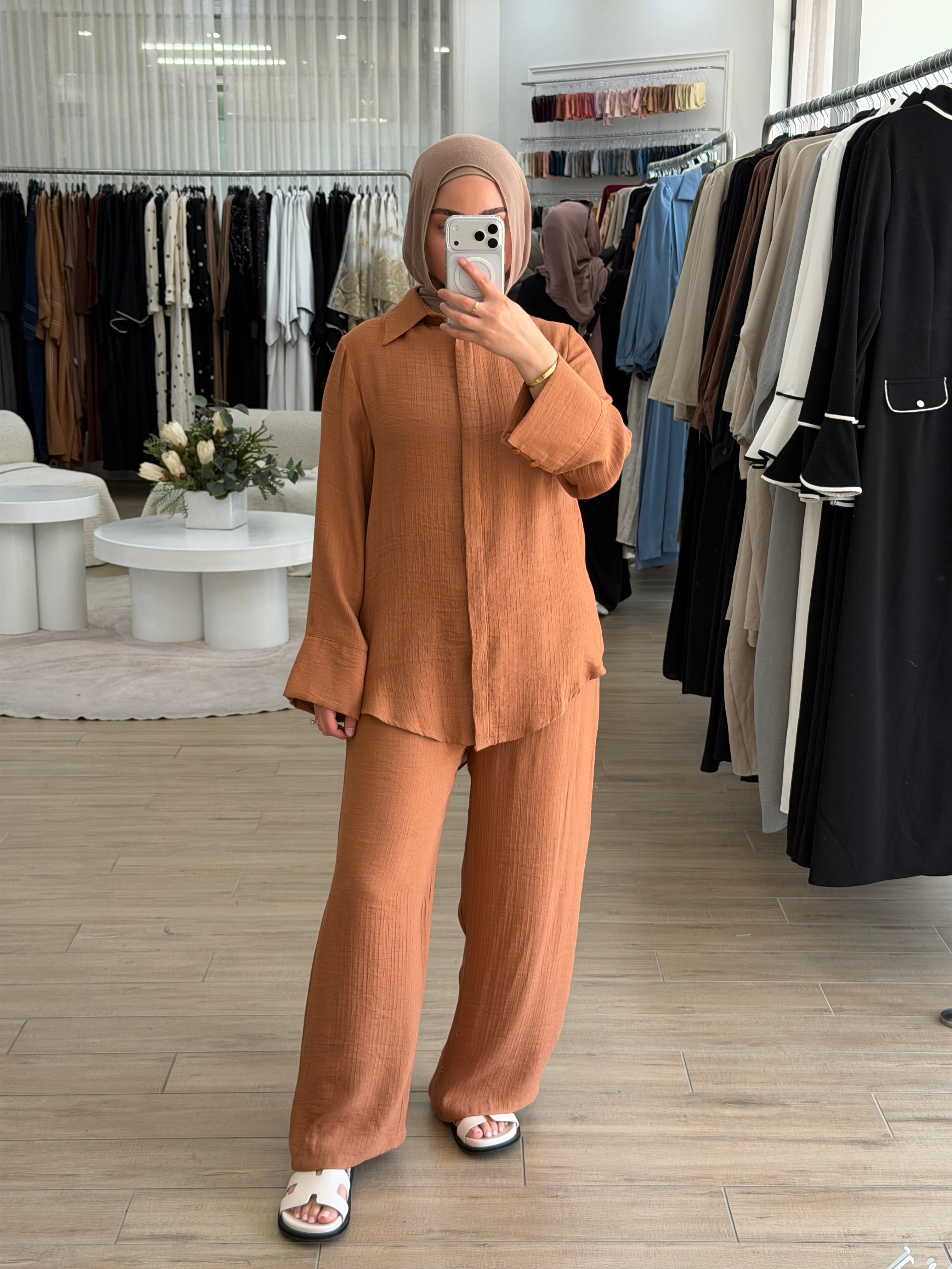 A beautifully coordinated two-piece outfit designed for simple sophistication. This set includes a relaxed-fit top and matching pants, crafted to make refined modest dressing easier than ever.