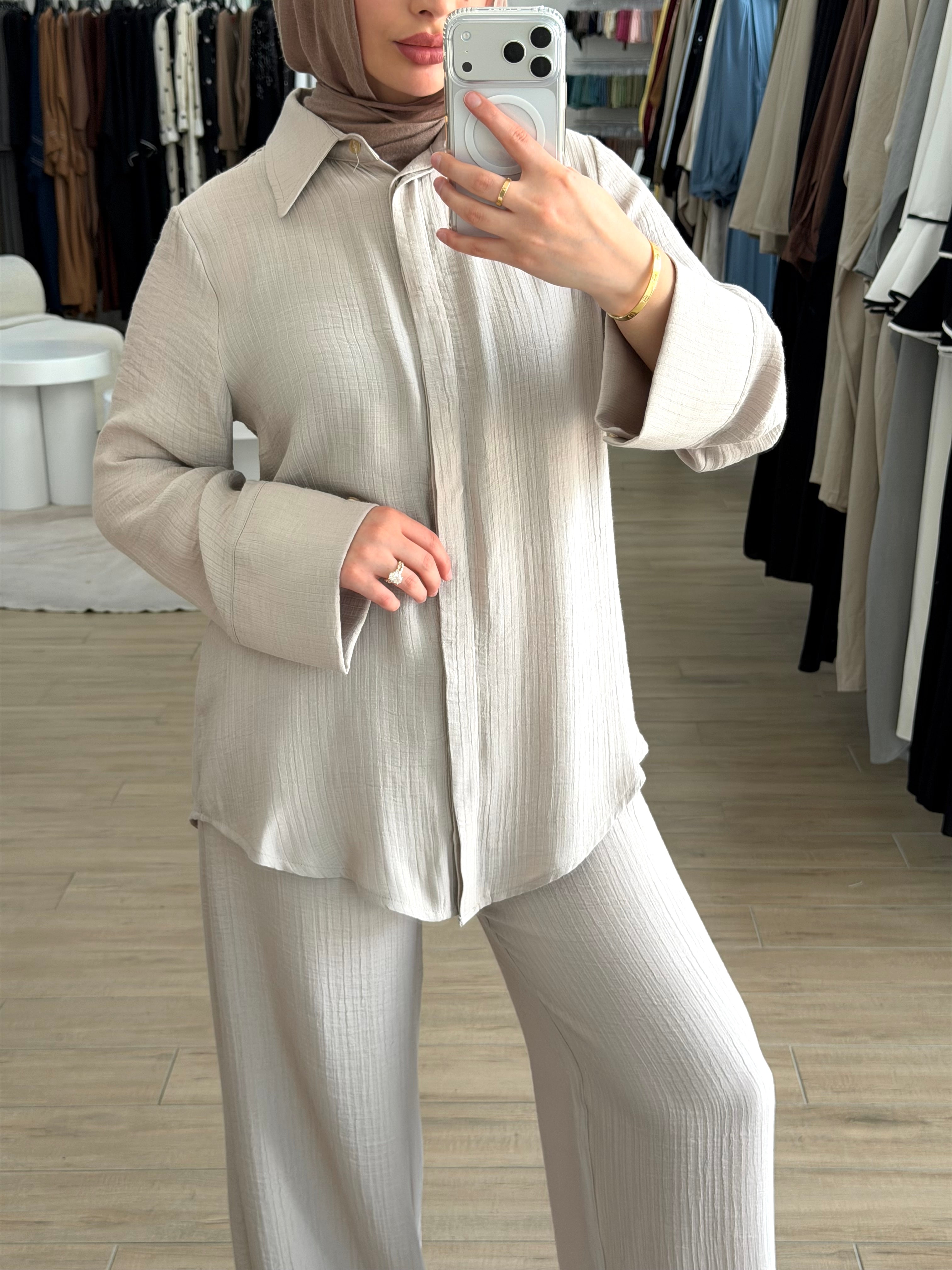 A beautifully coordinated two-piece outfit designed for simple sophistication. This set includes a relaxed-fit top and matching pants, crafted to make refined modest dressing easier than ever.