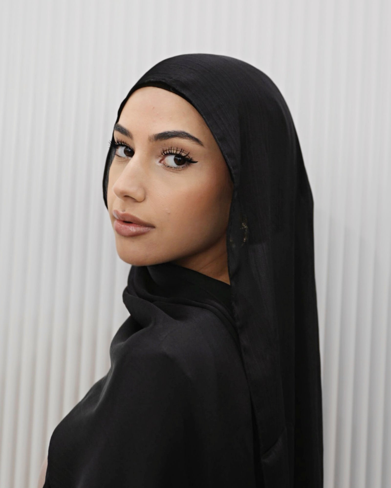 Shimmer Hijab, lightweight with a sparkling, shimmery finish, designed to add a glamorous touch to elevated outfits and formal wear.