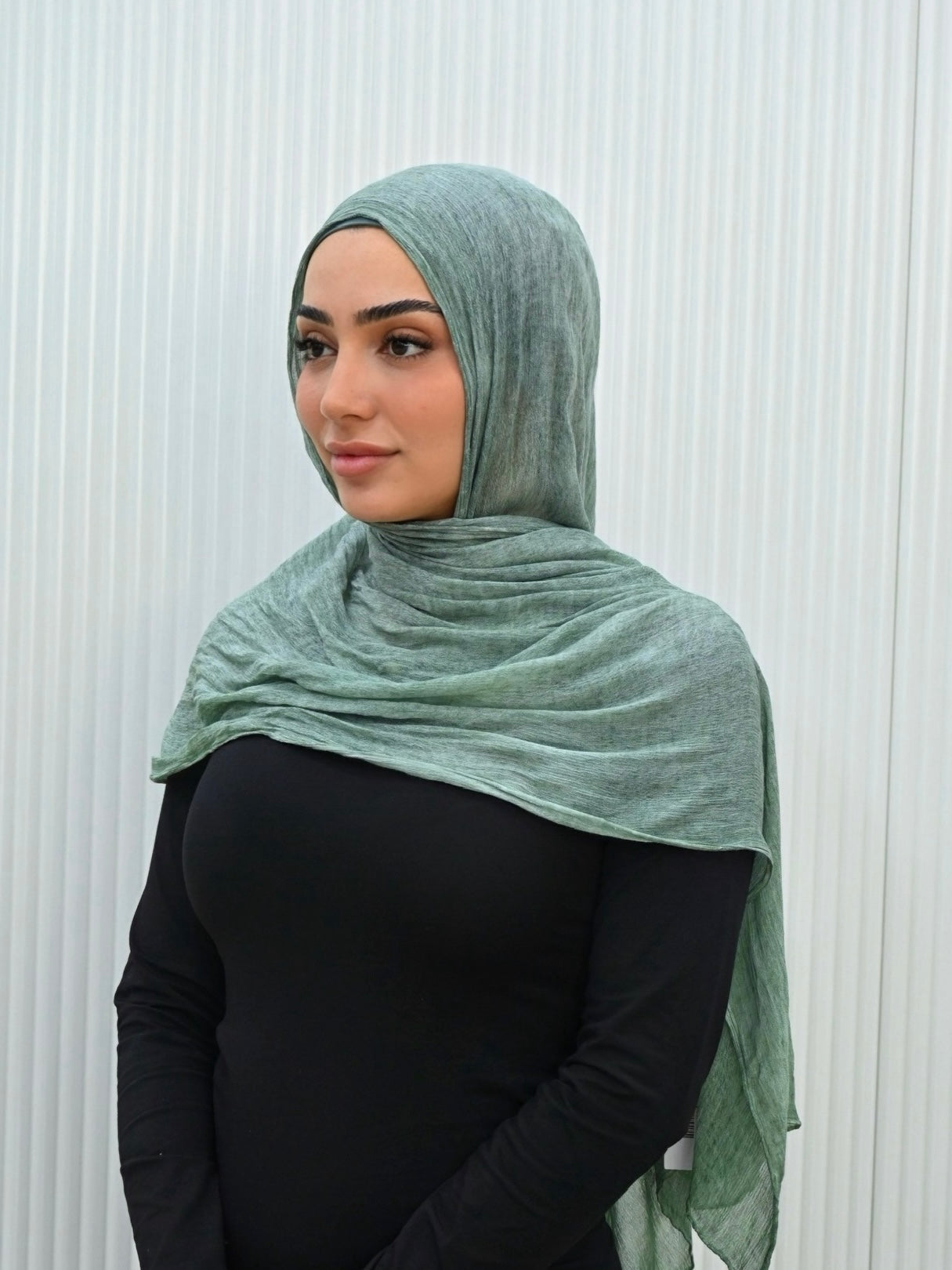Crafted from soft rayon, this textured hijab drapes effortlessly while offering a breathable and lightweight feel. 