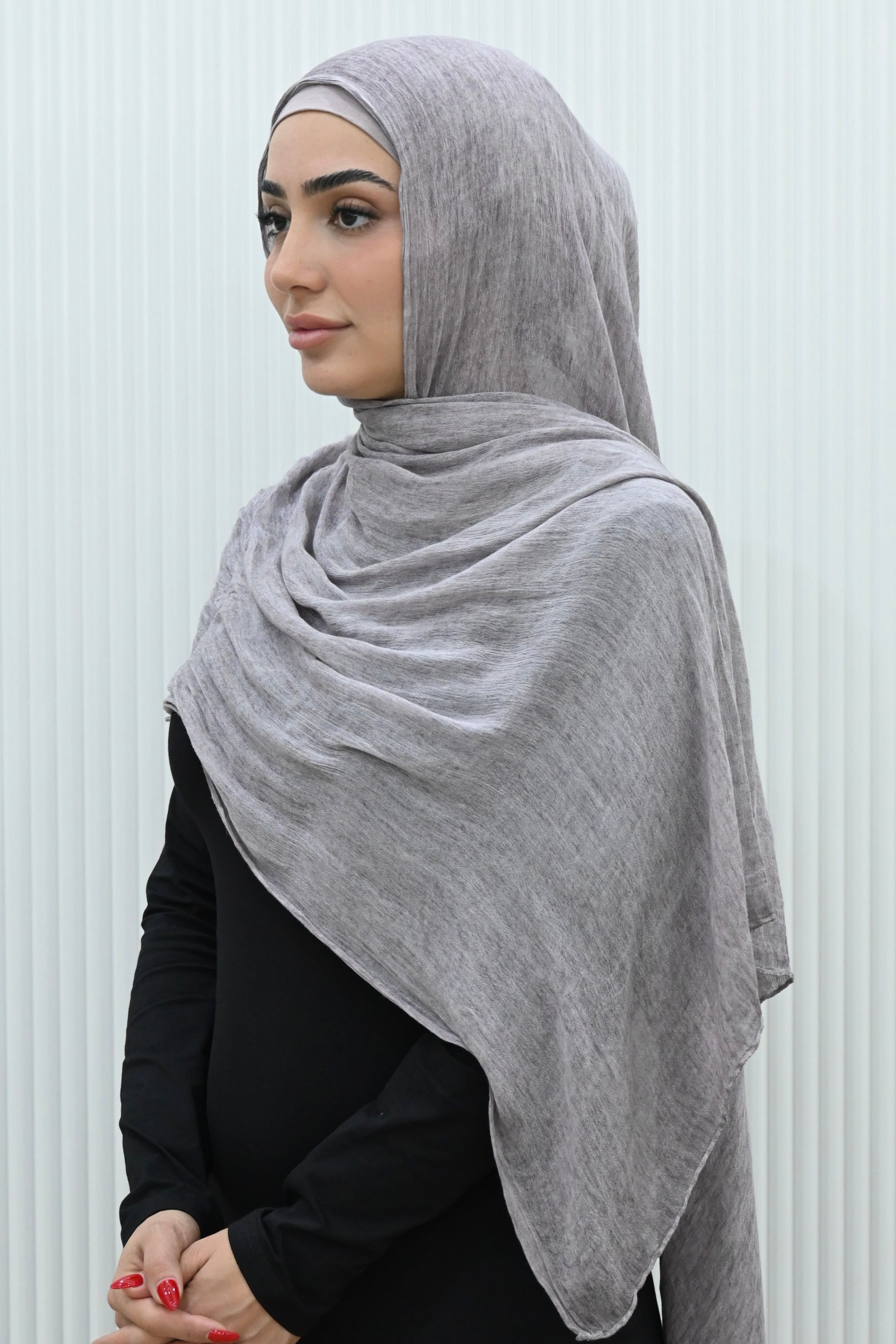 Crafted from soft rayon, this textured hijab drapes effortlessly while offering a breathable and lightweight feel. 